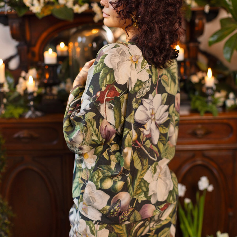 
                  
                    Model wearing a cropped kimono duster featuring vintage magnolia lithographs, delicate moth etchings, and charming bumblebee trim - Market of Stars
                  
                