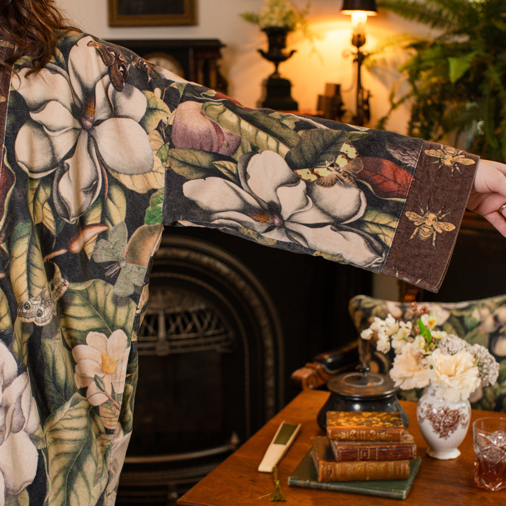 
                  
                    Model wearing a soft cotton velvet duster ft. vintage lithographs of magnolias & 1800's etchings of moths and pears - Market of Stars
                  
                