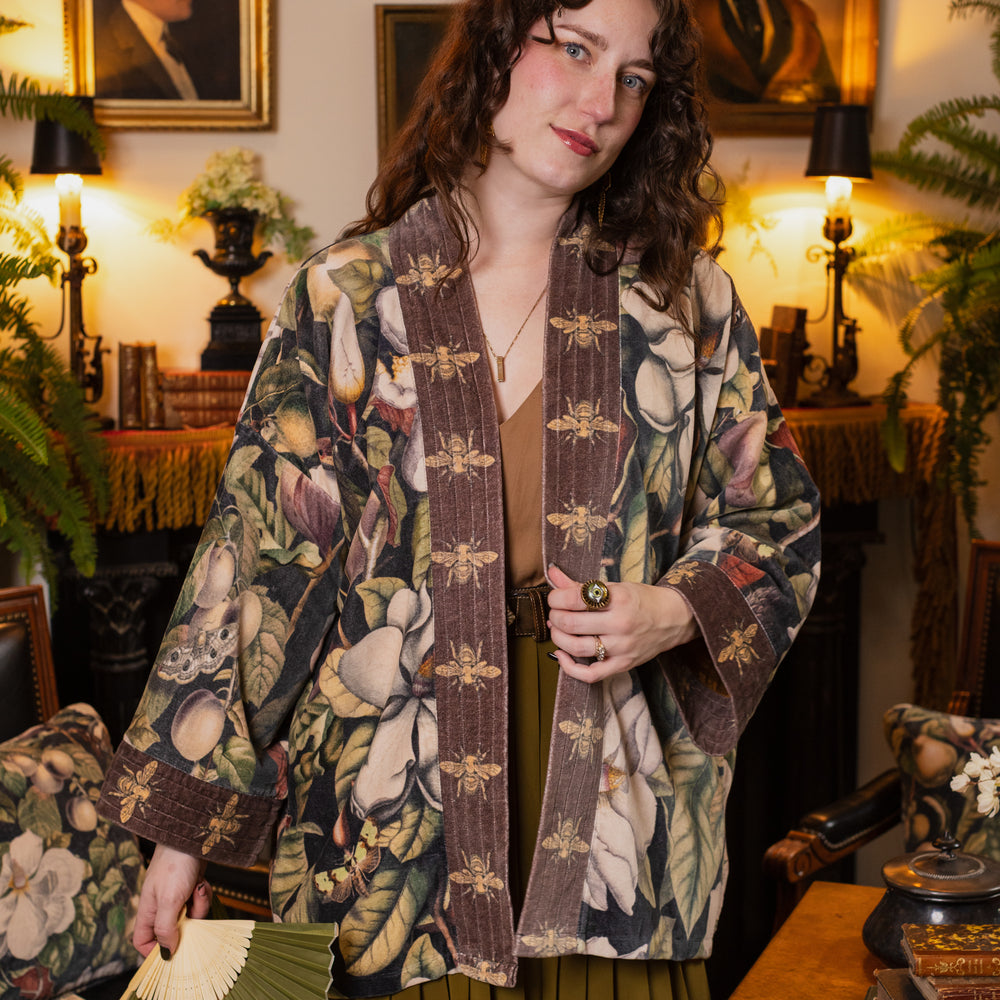 
                  
                    Model wearing a soft cotton velvet duster ft. vintage lithographs of magnolias & 1800's etchings of moths and pears - Market of Stars
                  
                