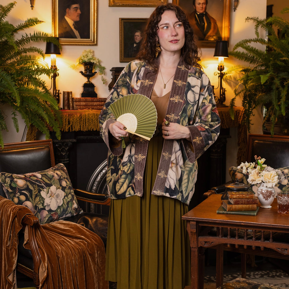 
                  
                    Model wearing a soft cotton velvet duster ft. vintage lithographs of magnolias & 1800's etchings of moths and pears - Market of Stars
                  
                