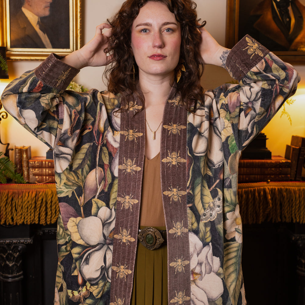 
                  
                    Model wearing a soft cotton velvet duster ft. vintage lithographs of magnolias & 1800's etchings of moths and pears - Market of Stars
                  
                