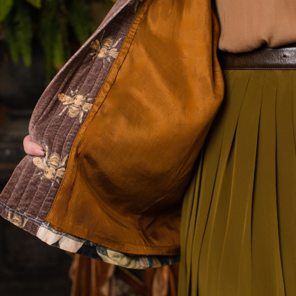 
                  
                    Model wearing a soft cotton velvet duster ft. vintage lithographs of magnolias & 1800's etchings of moths and pears - Market of Stars
                  
                