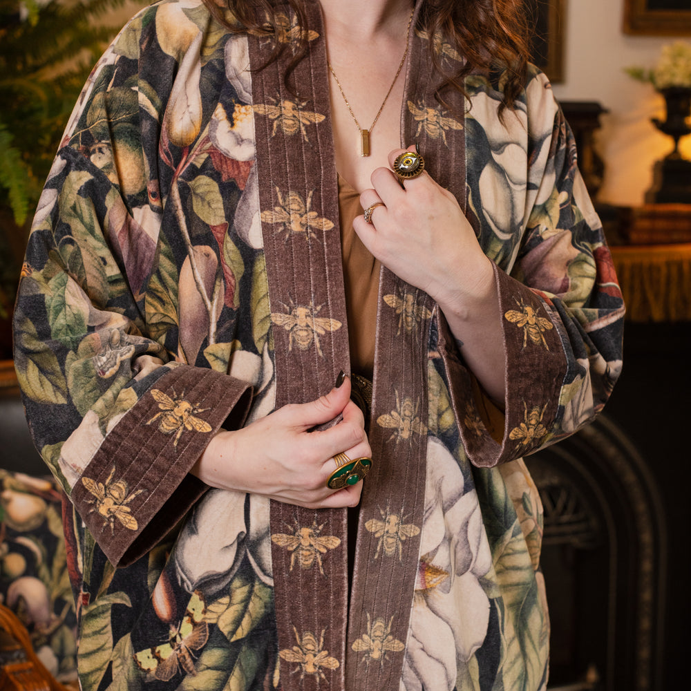 
                  
                    Model wearing a soft cotton velvet duster ft. vintage lithographs of magnolias & 1800's etchings of moths and pears - Market of Stars
                  
                