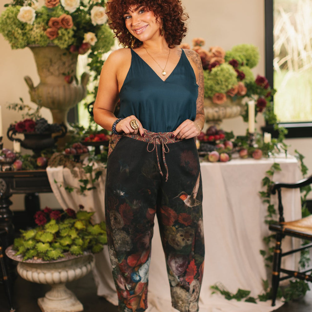 Model wearing the Folklore Artist Pant featuring the Bird-of-Peace embroidery and unfinished William Morris textile designs—artful linen blend pants by Market of Stars.