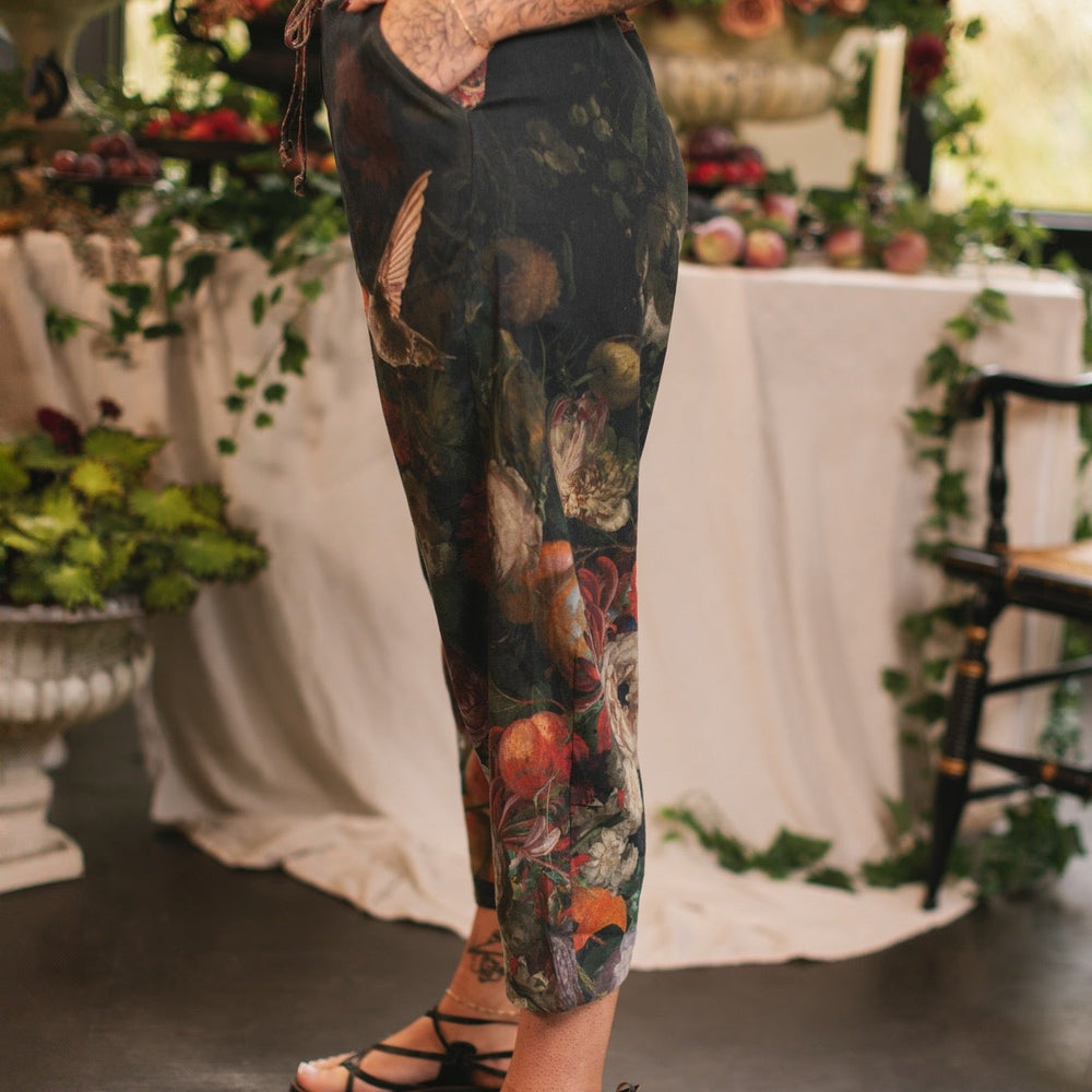 
                  
                    Model wearing the Folklore Artist Pant featuring the Bird-of-Peace embroidery and unfinished William Morris textile designs—artful linen blend pants by Market of Stars.
                  
                