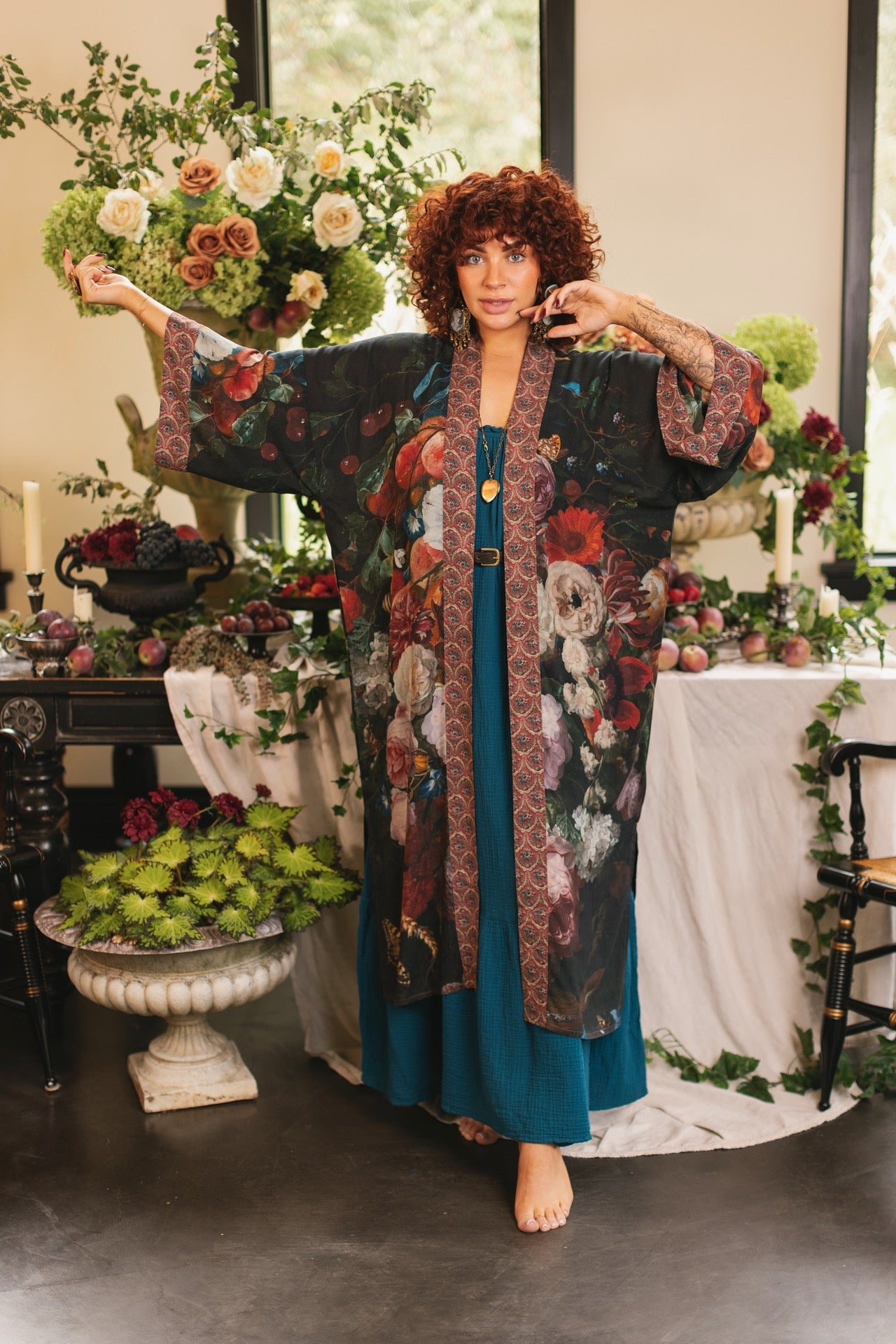 Model showcasing the Flight of Fancy Opera Robe featuring vibrant hummingbirds and historic floral paintings by Rachel Ruysch – Market of Stars.