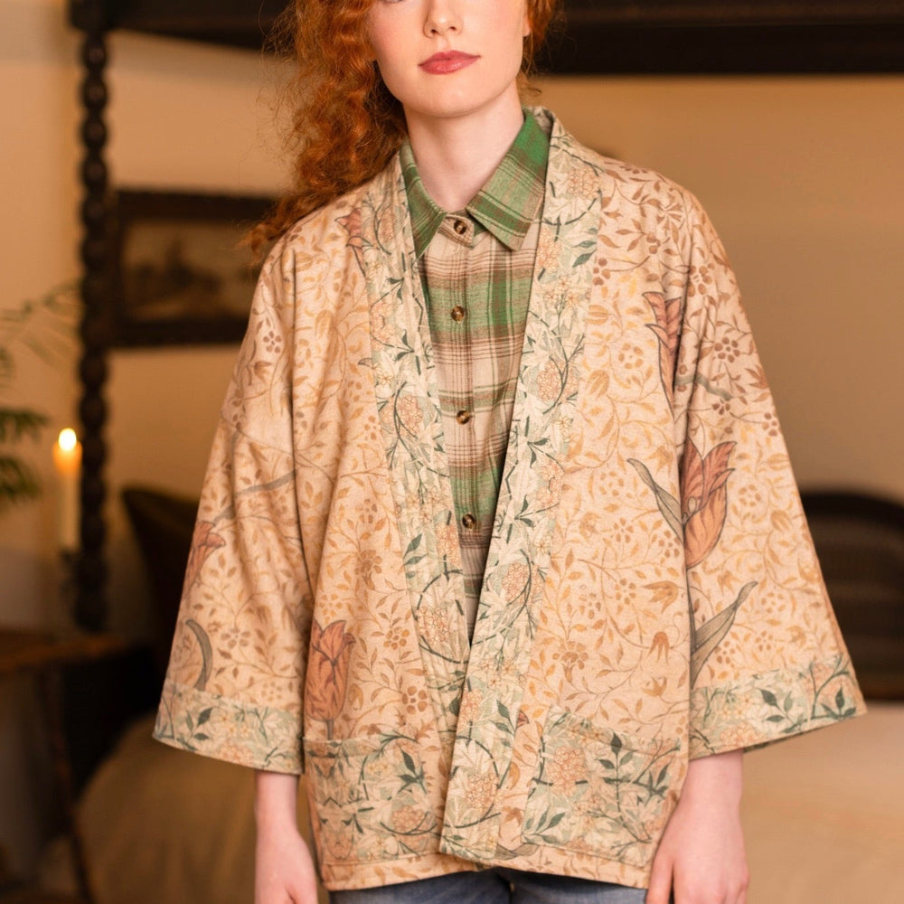 
                  
                    Model in cozy Folklore cottage cardigan featuring Bird-of-Peace embroidery and unfinished William Morris textile art in soft earthy tones – Market of Stars.
                  
                
