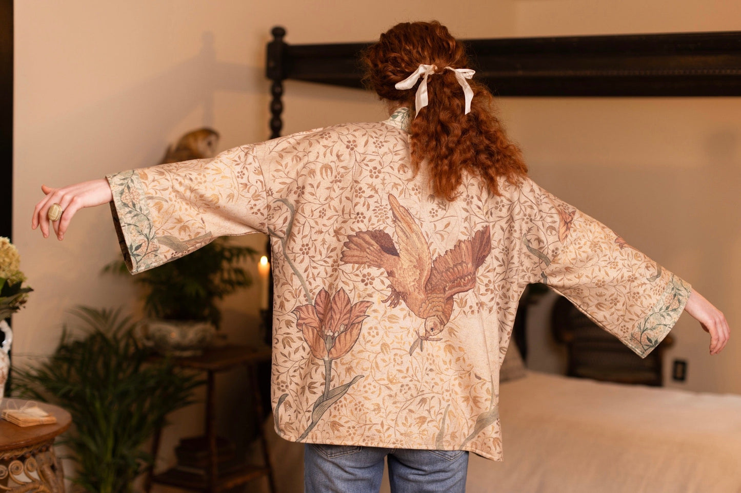 Model in cozy Folklore cottage cardigan featuring Bird-of-Peace embroidery and unfinished William Morris textile art in soft earthy tones – Market of Stars.