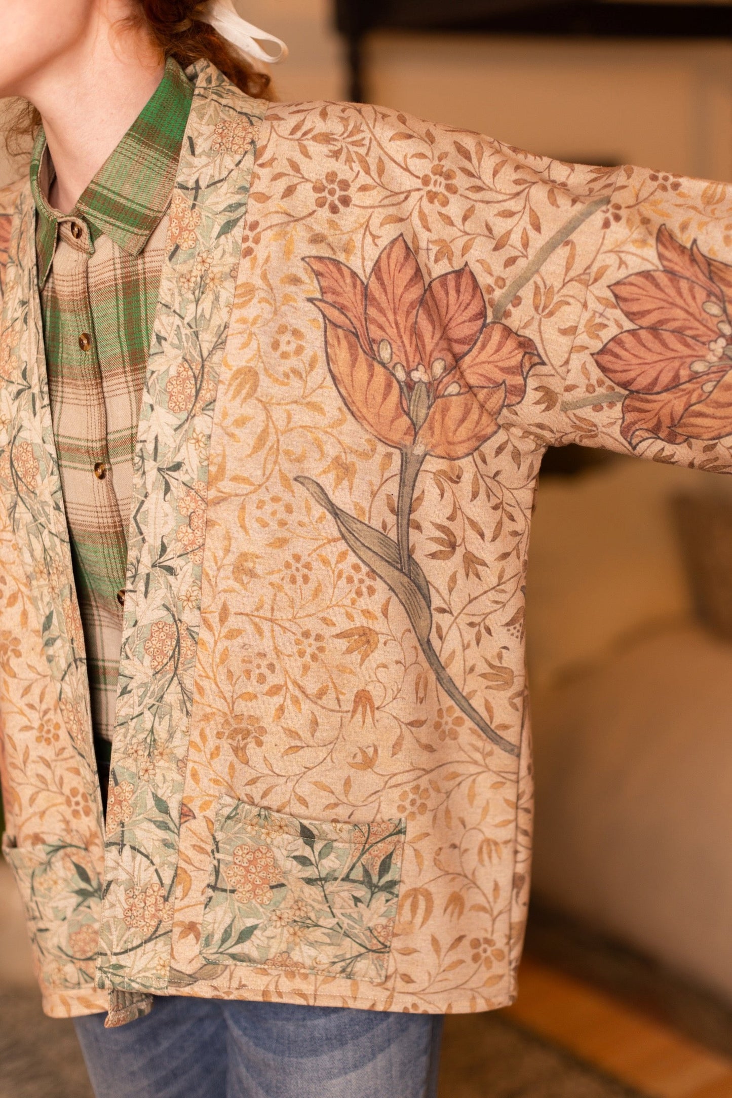 Model in cozy Folklore cottage cardigan featuring Bird-of-Peace embroidery and unfinished William Morris textile art in soft earthy tones – Market of Stars.