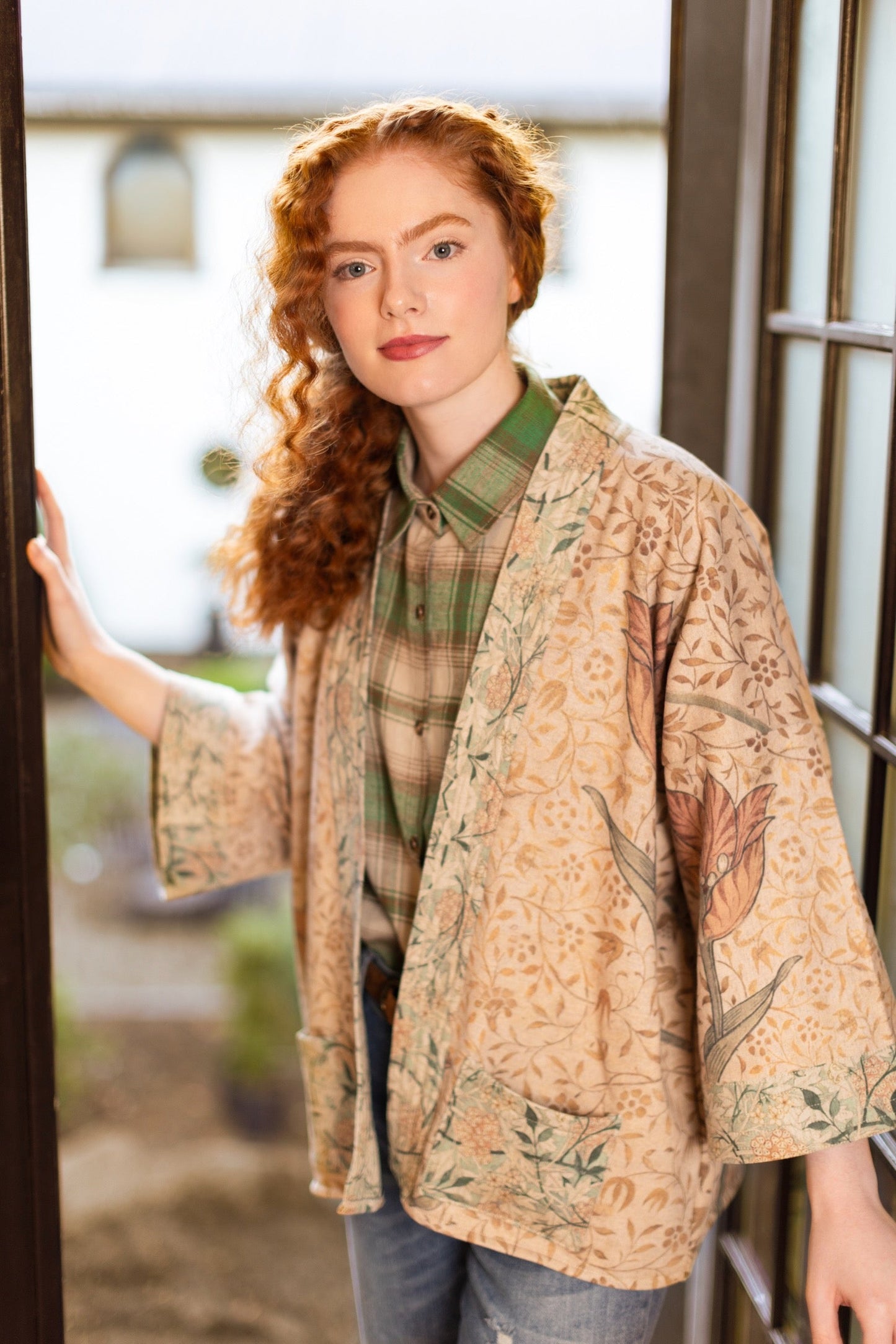 Model in cozy Folklore cottage cardigan featuring Bird-of-Peace embroidery and unfinished William Morris textile art in soft earthy tones – Market of Stars.