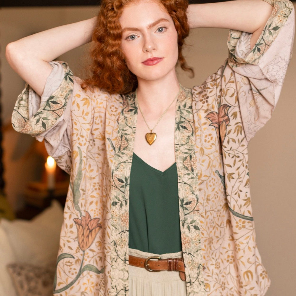Model wearing full-length Folklore opera duster featuring Bird-of-Peace embroidery and unfinished William Morris textile panels in soft earthy tones – Market of Stars.