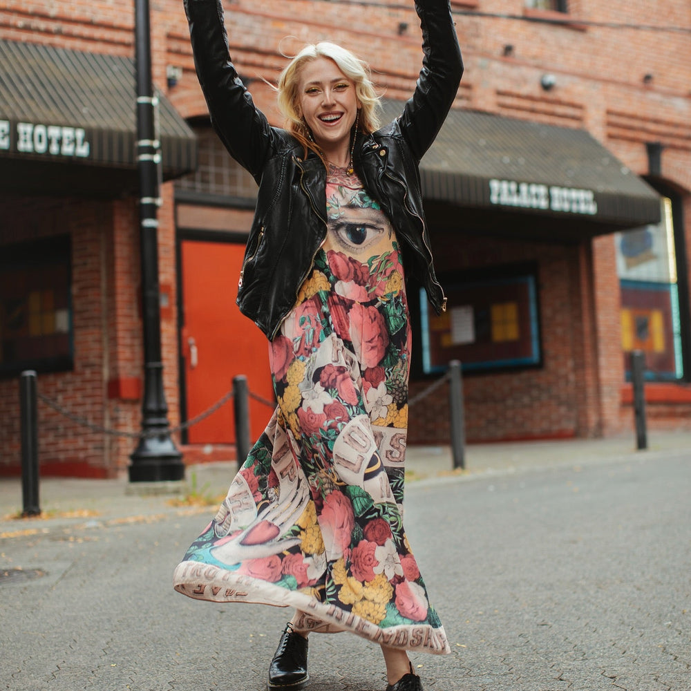 
                  
                    Model wearing reversible bamboo viscose slip dress featuring vintage symbols of friendship, love, and truth with pink and rose palette – Market of Stars.
                  
                