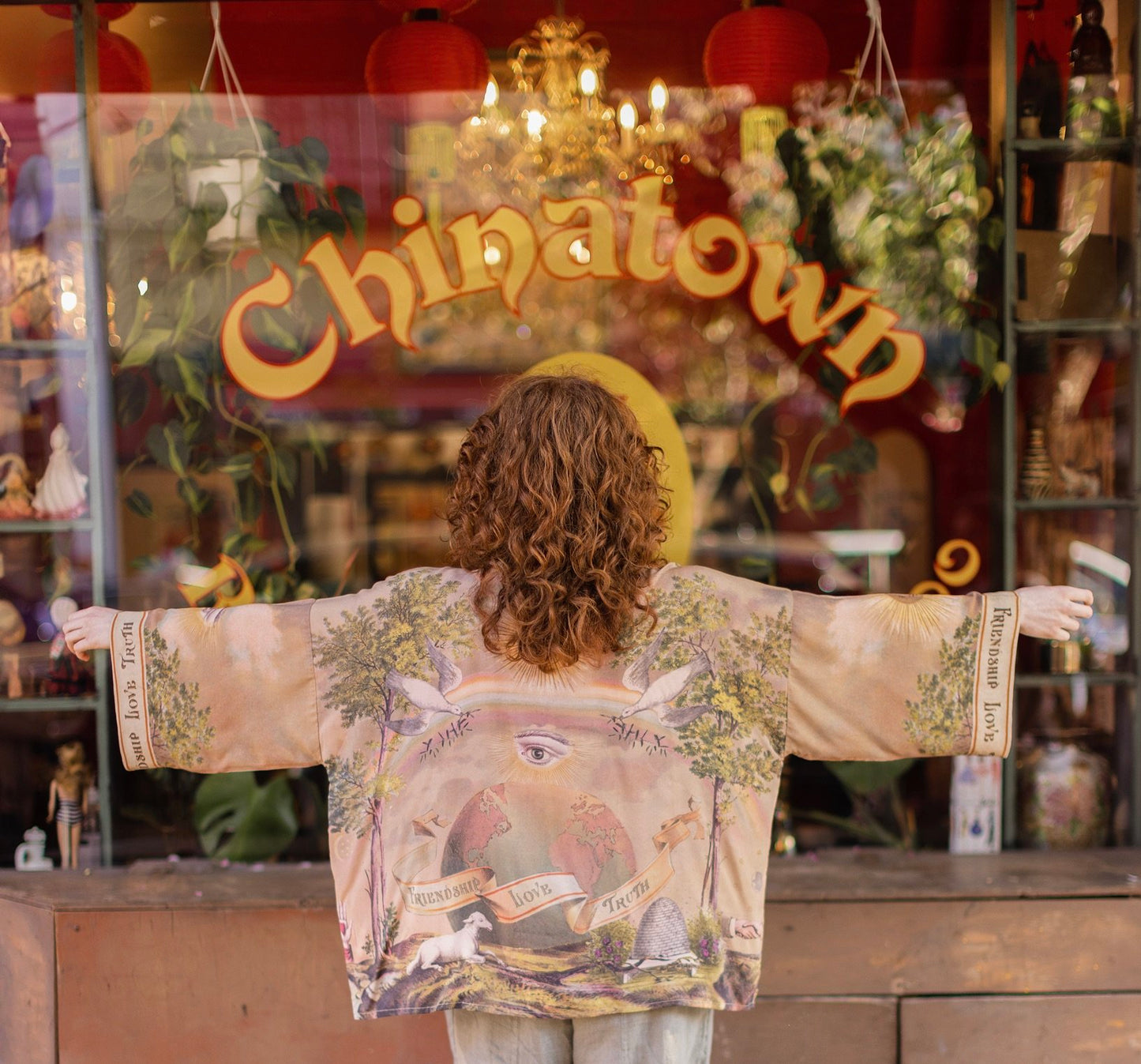 Vintage-inspired cropped kimono featuring historic symbols of friendship, love, and truth in a soft sun-washed palette of lavender, sage, gold, and aqua – Market of Stars.