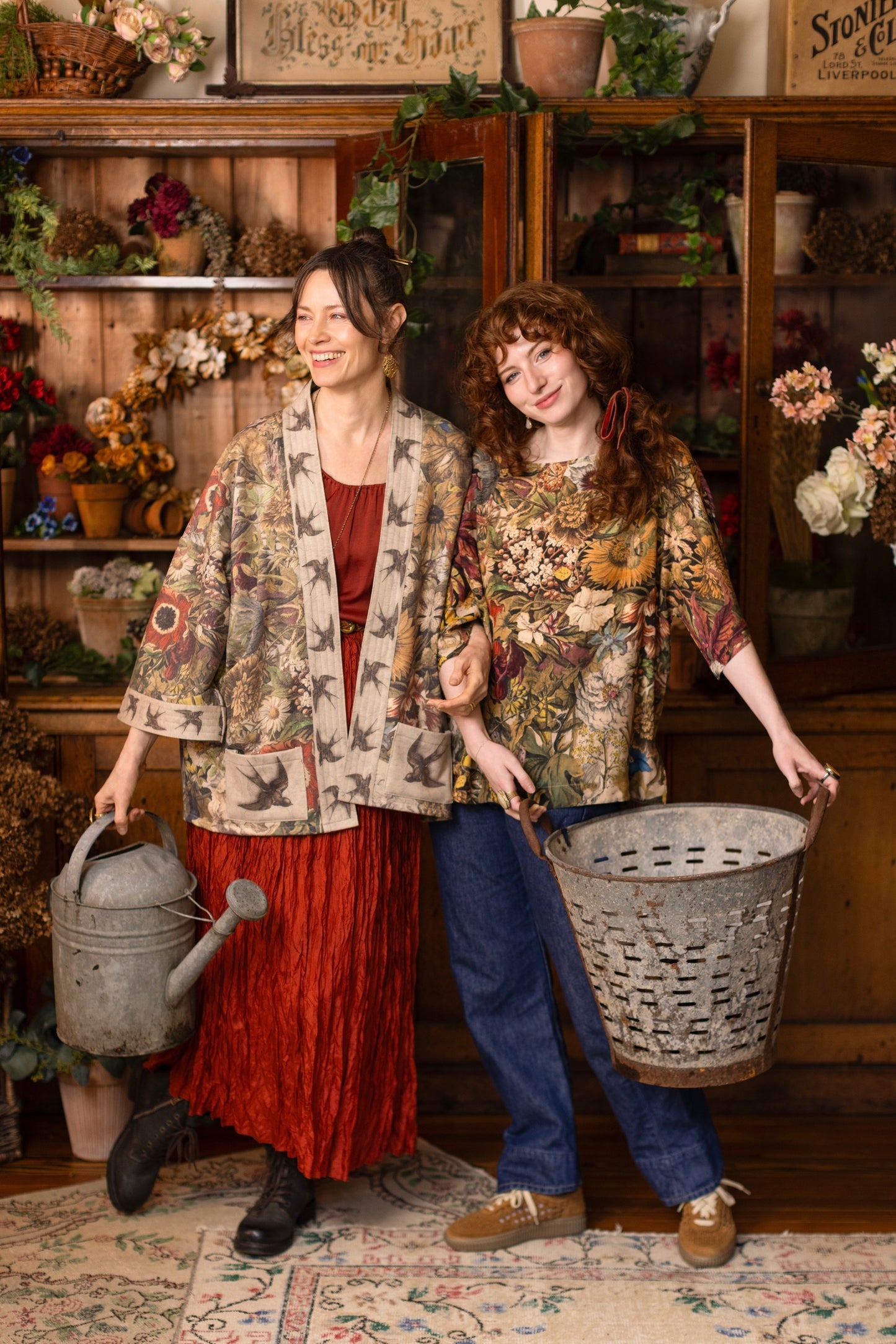 Model wearing a soft fleece cottage cardigan featuring rich 1700s botanical blooms and swallow trim - Market of Stars