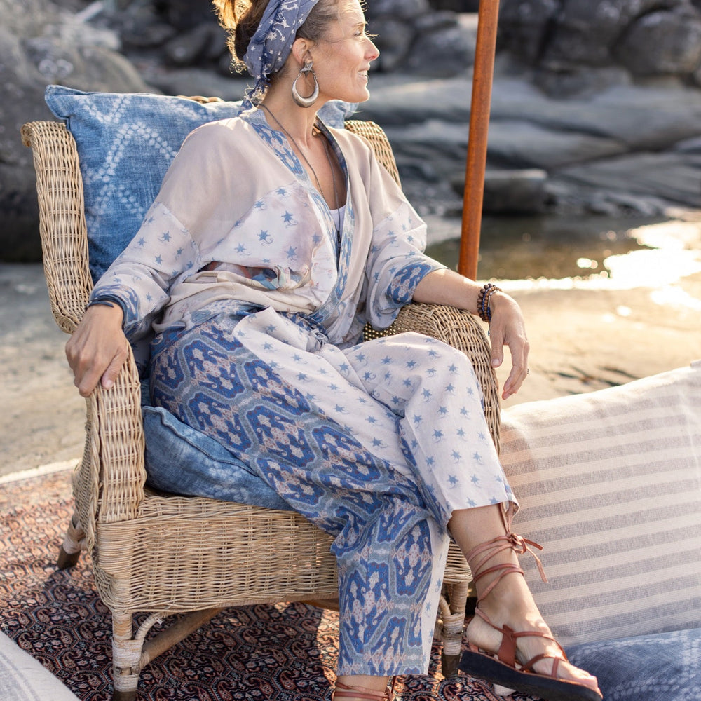 Model wearing Head in the Clouds Artist Pants featuring starry front panel and Turkish rug trim from Liotard’s portrait The Painter’s Wife-Market of Stars