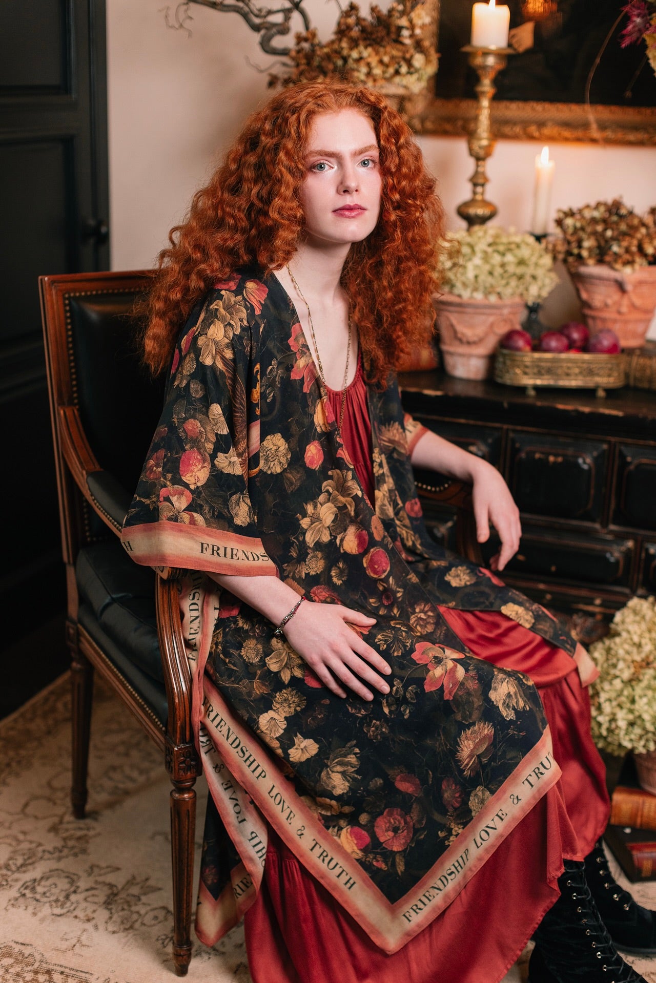 Model wearing a flowy bamboo-viscose duster featuring a collage of antique artwork with romance, loyalty, and old-world beauty - Market of Stars