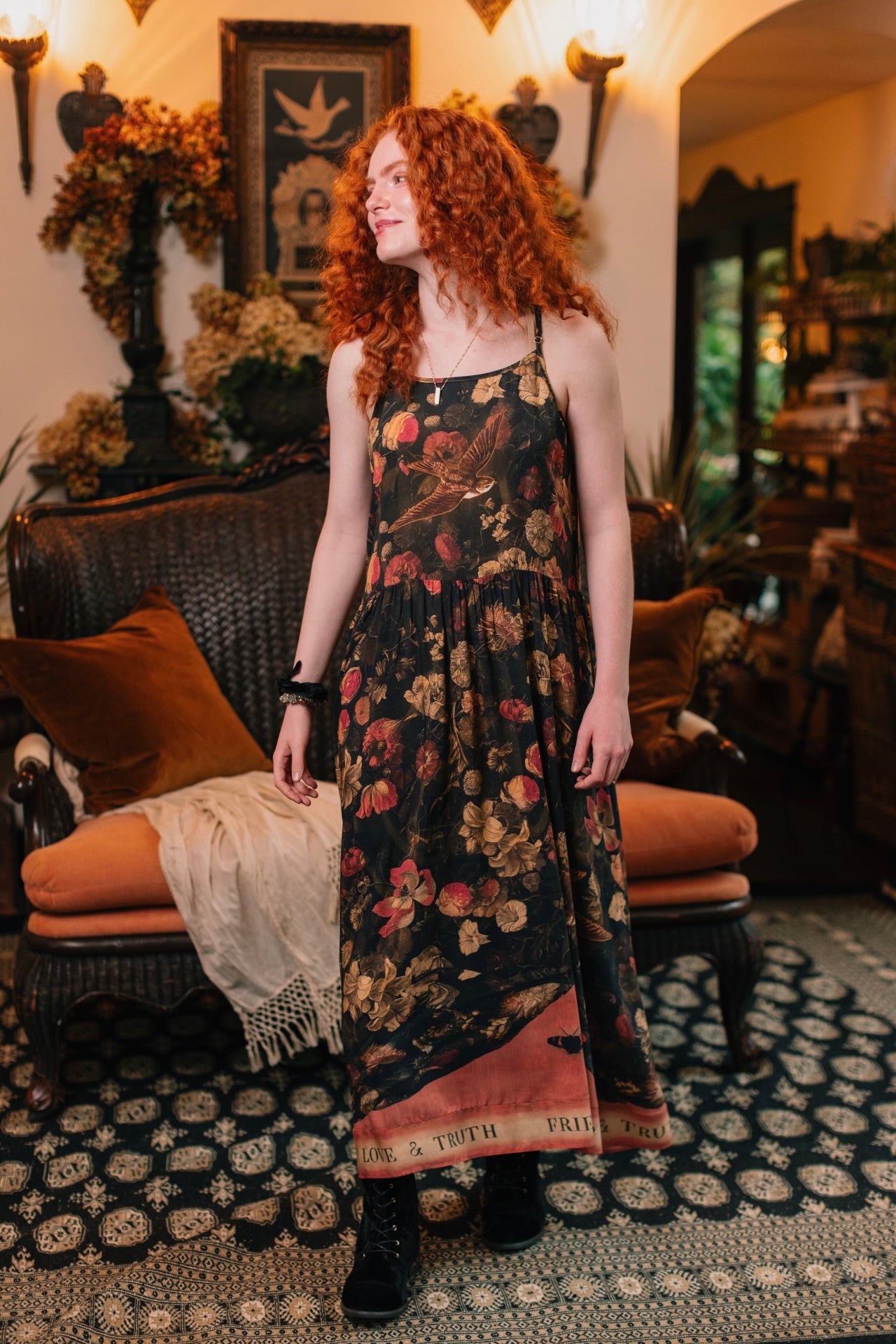 Model wearing a maxi-length bamboo-viscose slip dress featuring a collage of antique artwork with romance, loyalty, and old-world beauty - Market of Stars