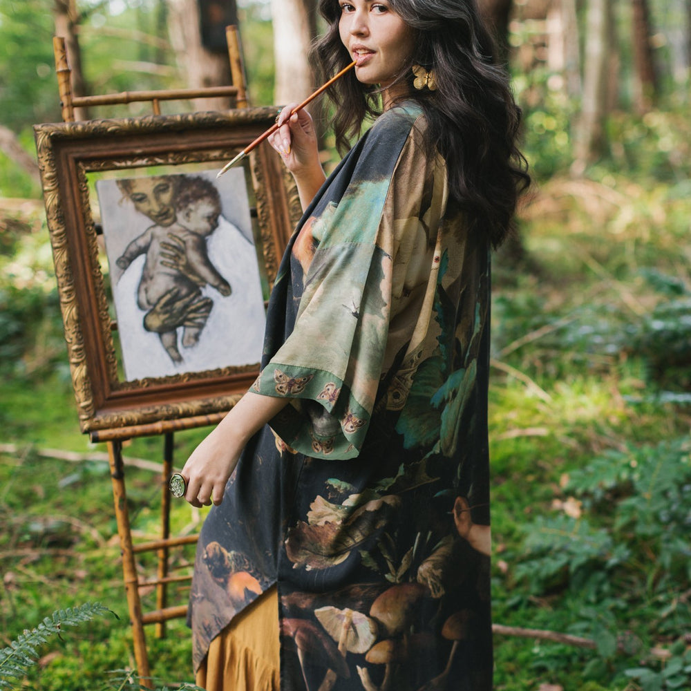 Model wearing the Heartwork Opera Duster featuring Artemisia Gentileschi’s self-portrait surrounded by forest, birds, and butterflies – Market of Stars.