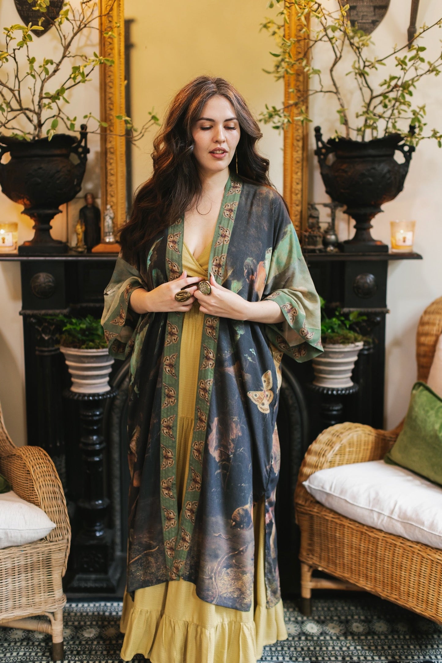 Model wearing the Heartwork Opera Duster featuring Artemisia Gentileschi’s self-portrait surrounded by forest, birds, and butterflies – Market of Stars.