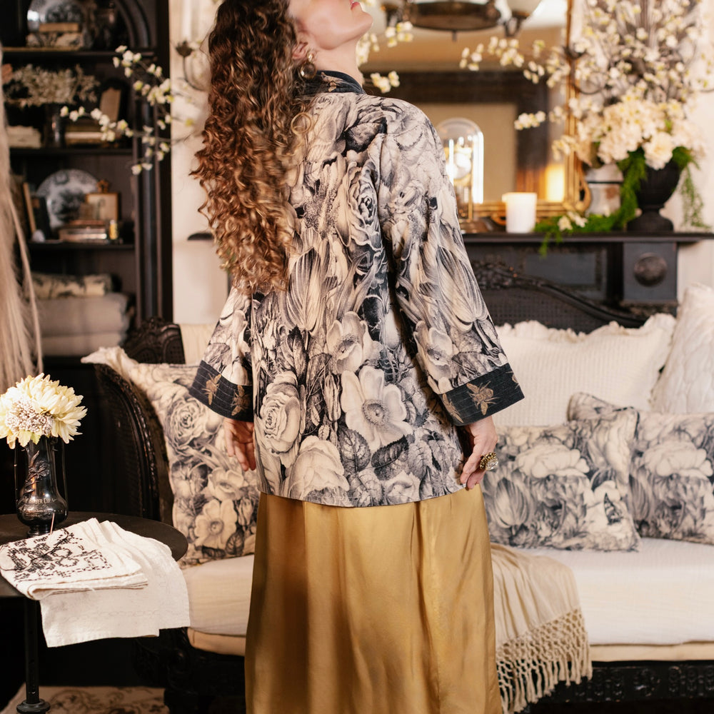 Model wearing a soft cotton velvet duster ft. 1900's floral lithographs. A garden dreamt up in ink - Market of Stars