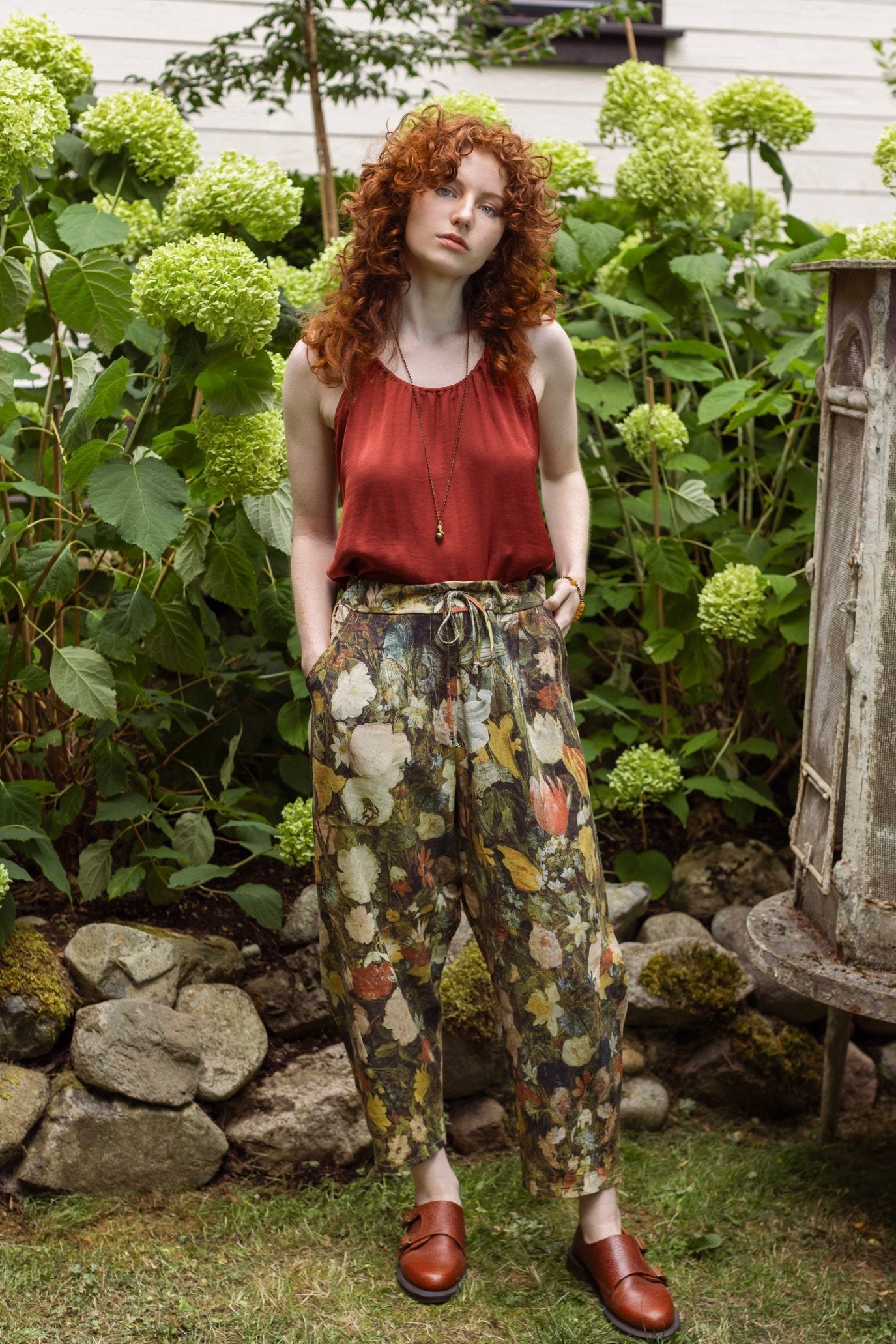 Model wearing the I Dream in Flowers Artist Pants featuring romantic floral artwork by Jan Brueghel and Victorian bumblebee trim, styled for everyday ease – Market of Stars