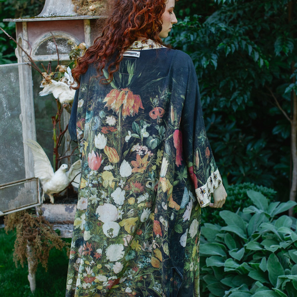 Model wearing the I Dream in Flowers Opera Duster featuring floral oil painting by Jan Brueghel and Victorian bumblebee trim – Market of Stars.