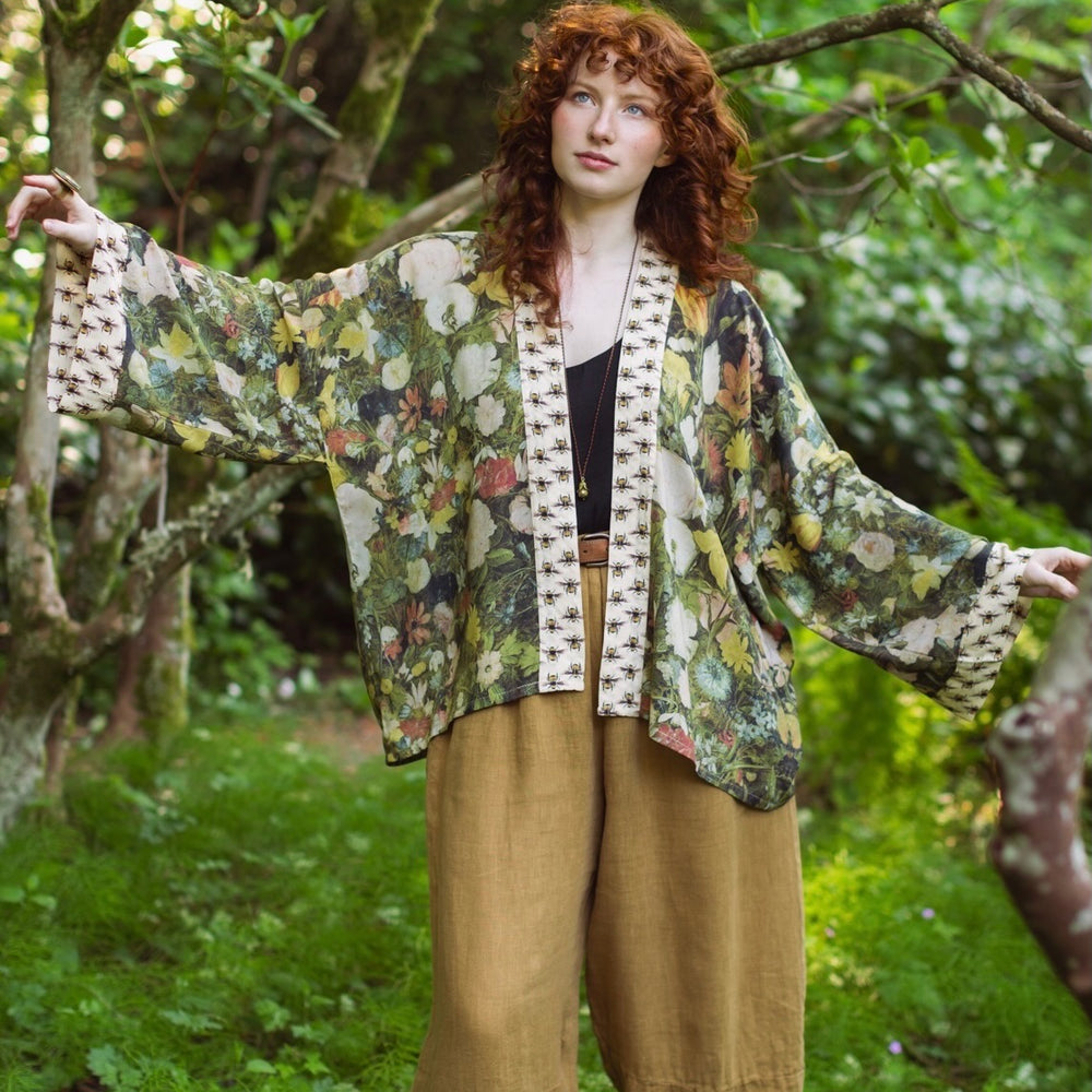 Model wearing the I Dream in Flowers cropped kimono featuring romantic floral artwork by Jan Brueghel and Victorian bumblebee trim – Market of Stars.