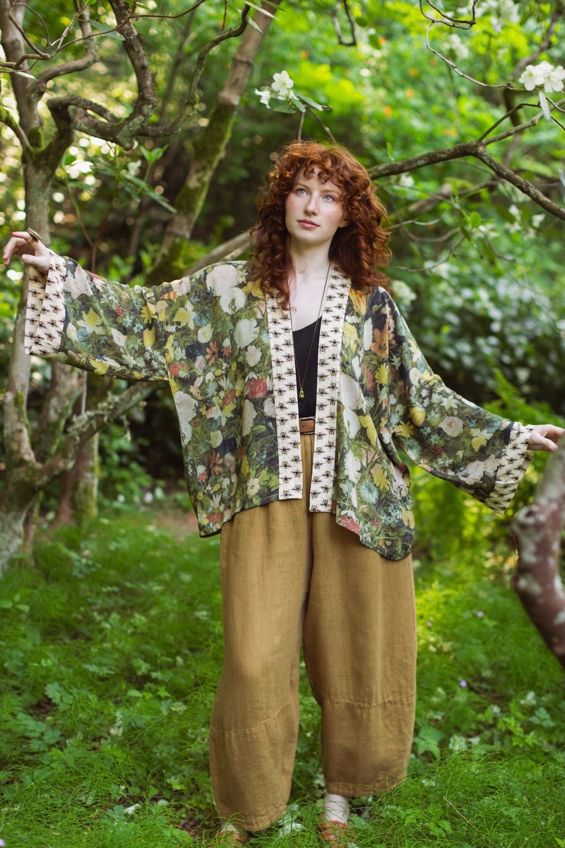 Model wearing the I Dream in Flowers cropped kimono featuring romantic floral artwork by Jan Brueghel and Victorian bumblebee trim – Market of Stars.