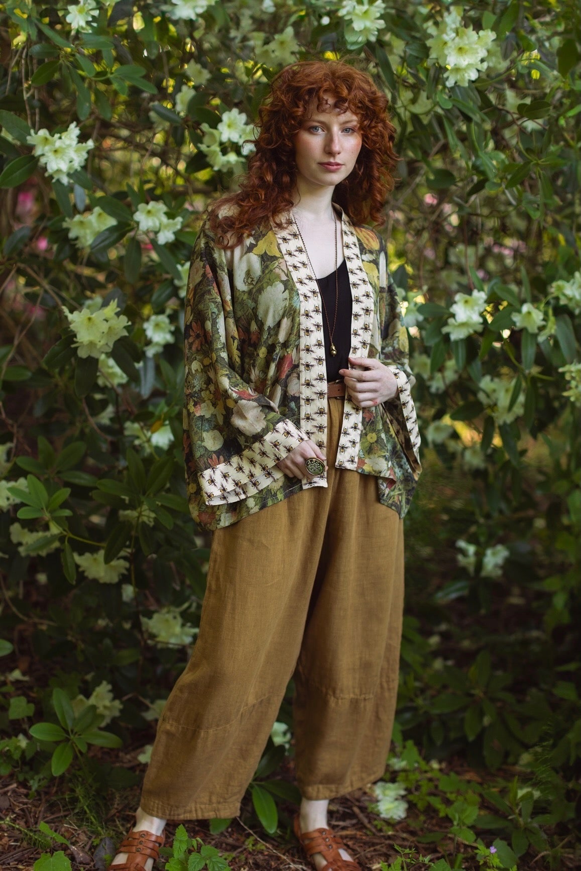 Model wearing the I Dream in Flowers cropped kimono featuring romantic floral artwork by Jan Brueghel and Victorian bumblebee trim – Market of Stars.