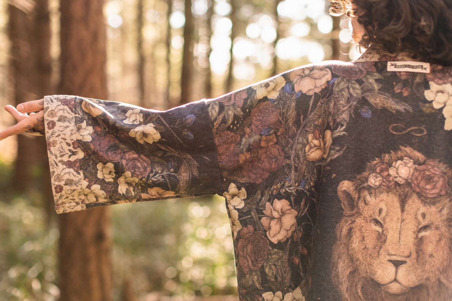 Model wearing the Lionheart Cottage Cardigan ft artwork by illustrator Jessica Roux - Market of Stars