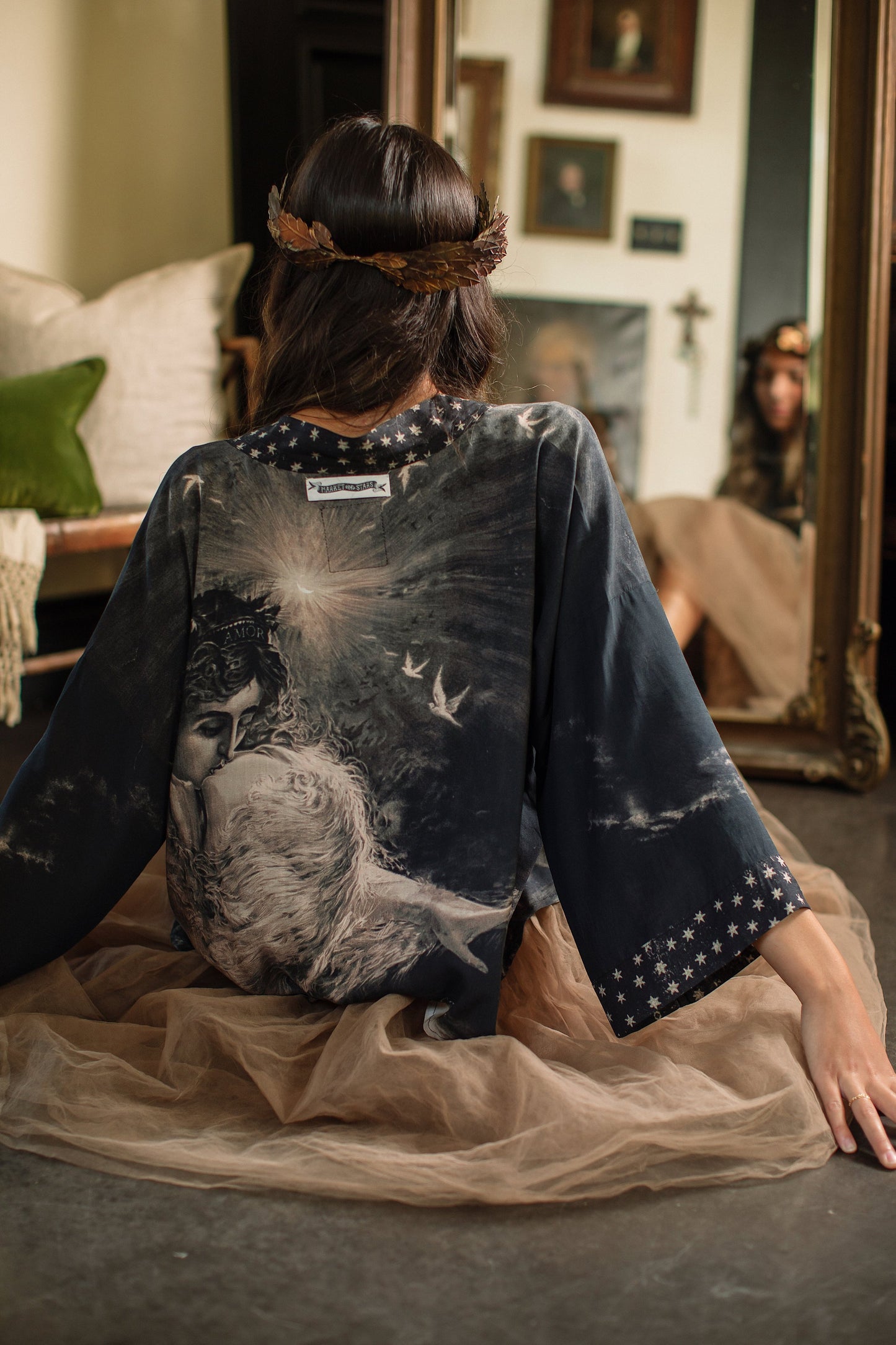 Model wearing Love Conquers All Kimono featuring an 1800s heart-shaped embrace, doves, crescent moon, and the words Amor Vincit Omnia – Market of Stars.