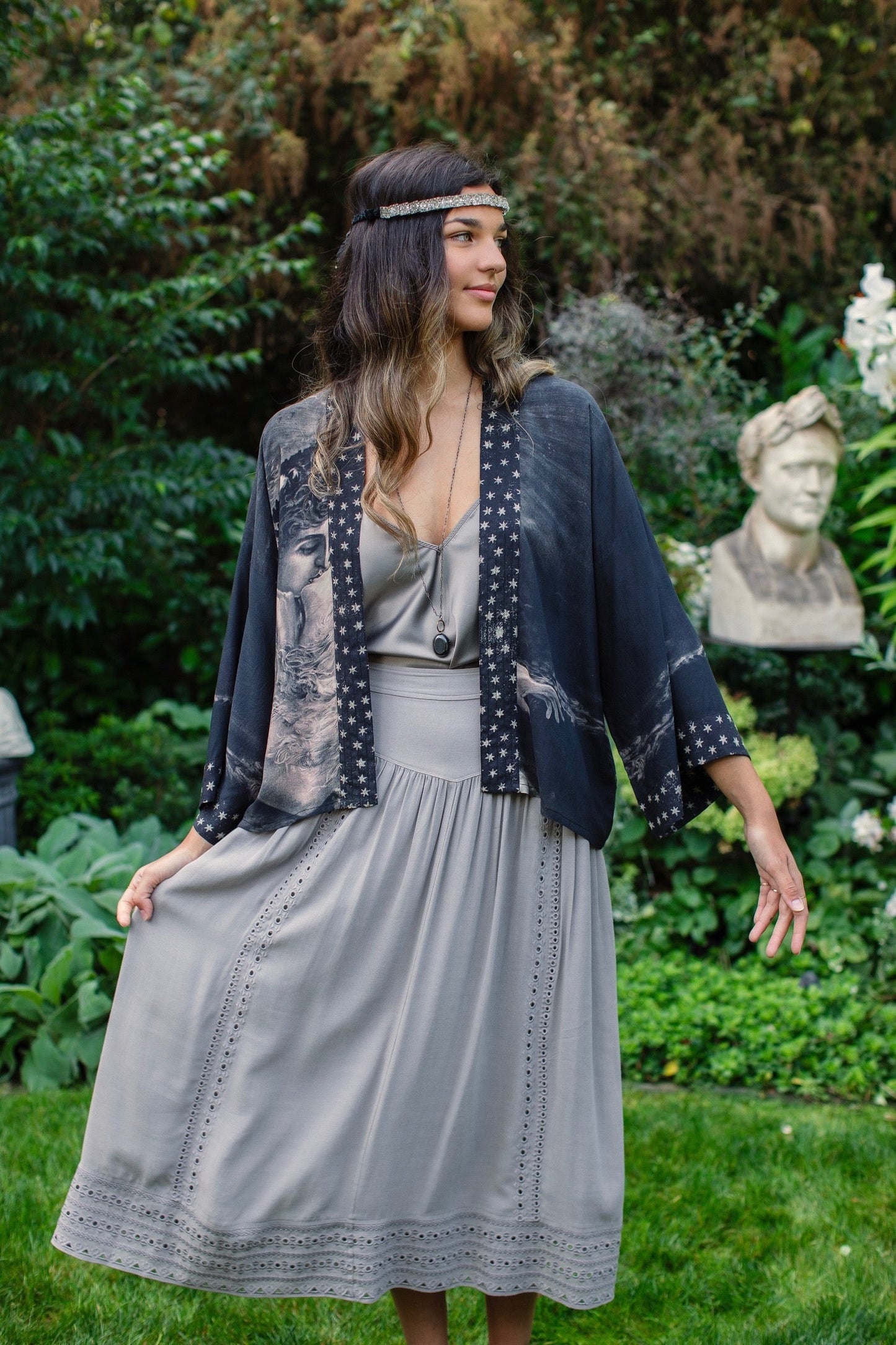 Model wearing Love Conquers All Kimono featuring an 1800s heart-shaped embrace, doves, crescent moon, and the words Amor Vincit Omnia – Market of Stars.