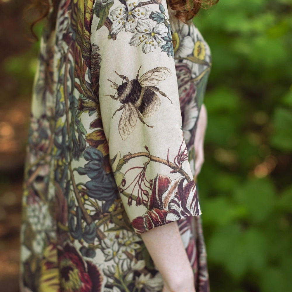 
                  
                    Model styled in Love Grows Wild Artist Dress featuring hand-coloured 1700s floral etchings and bumblebee detail – inspired by the French chemise – Market of Stars
                  
                