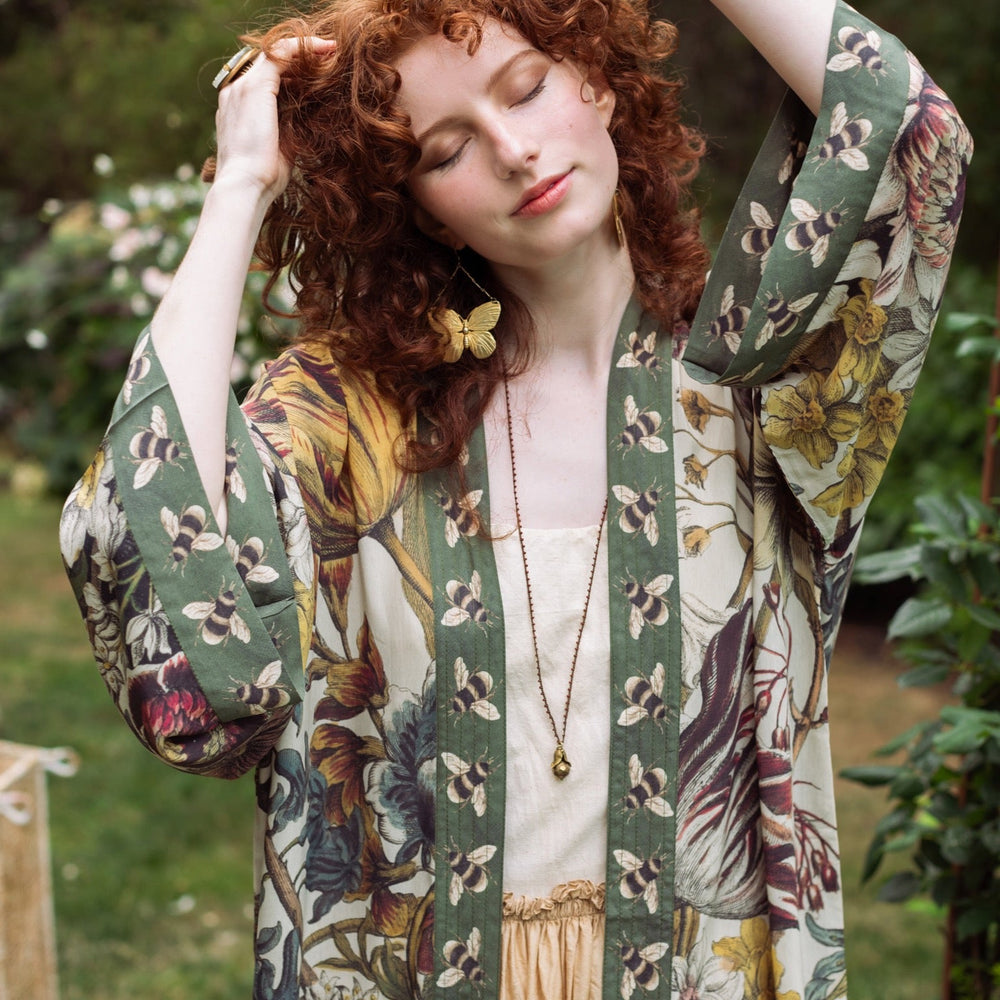 Model wearing kimono featuring 1700s March floral etchings and charming bumblebee trim inspired by vintage seed catalogues – Market of Stars.