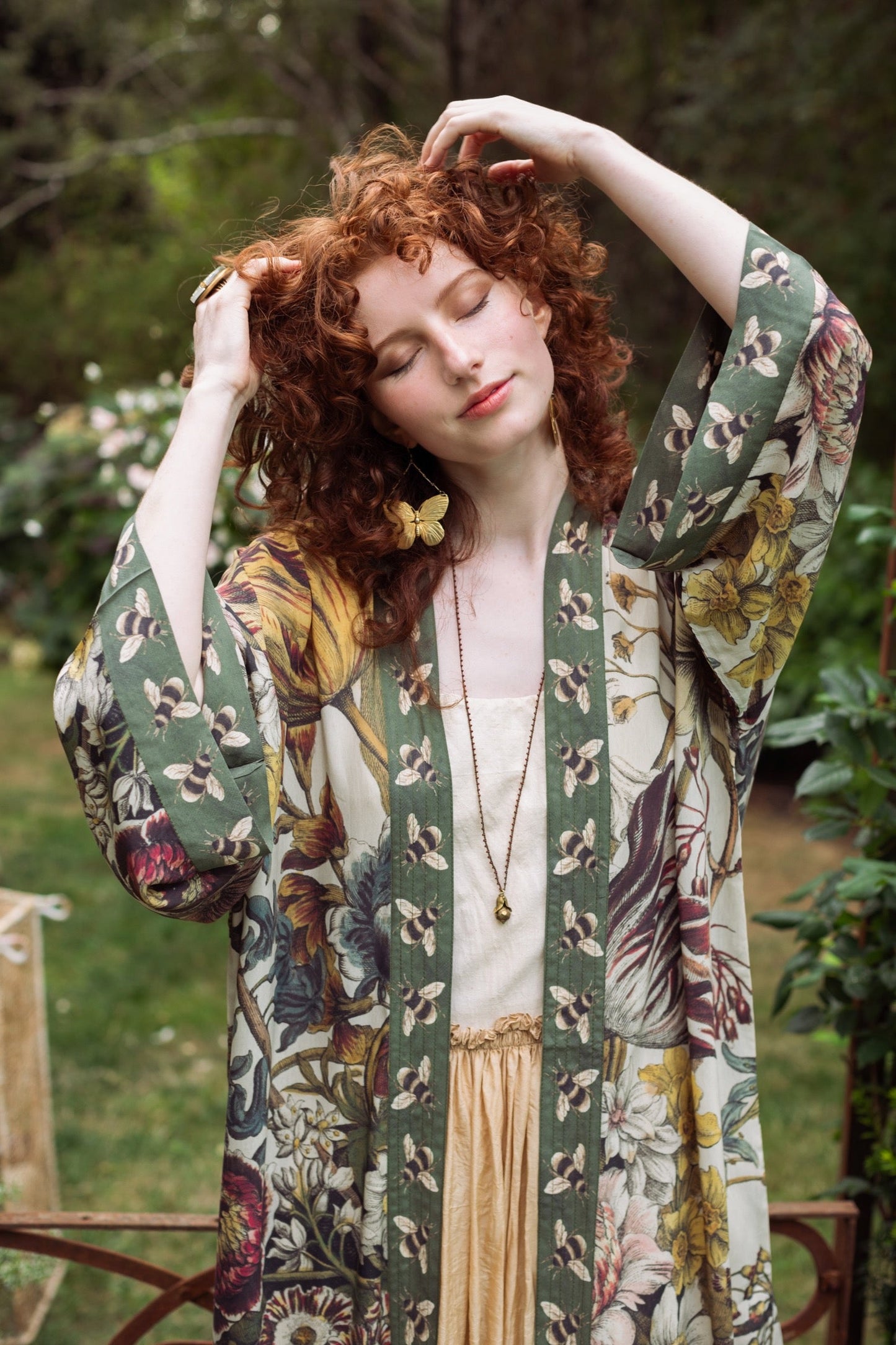 Model wearing kimono featuring 1700s March floral etchings and charming bumblebee trim inspired by vintage seed catalogues – Market of Stars.