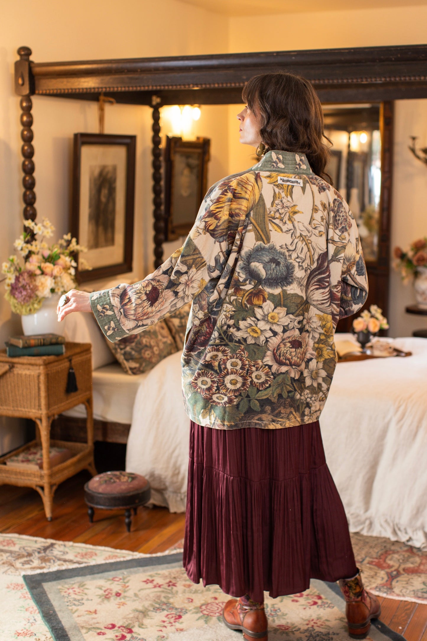 Model wearing a soft cotton velvet duster featuring lush 1700s botanical blooms and bumblebee trim - Market of Stars