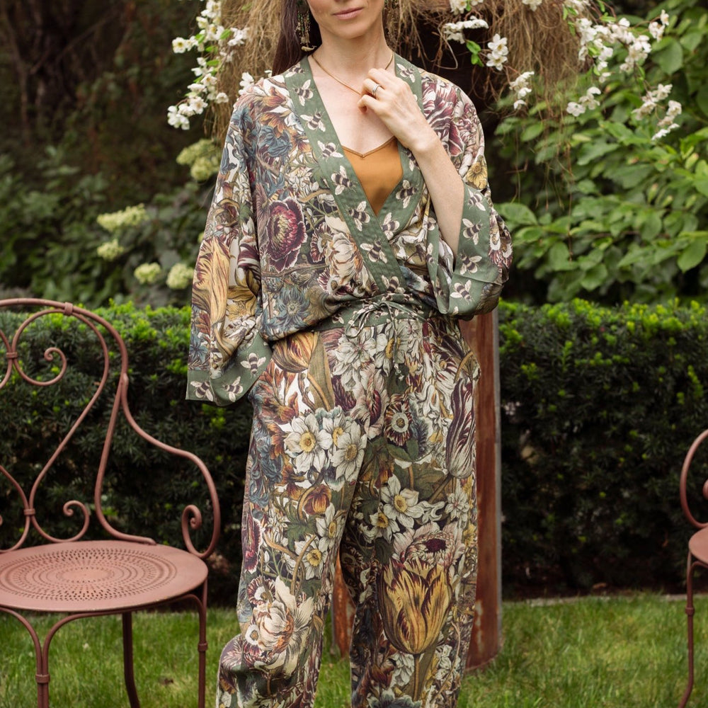 Model styled in Love Grows Wild Artist Pants featuring 1700s hand-coloured floral etchings and bumblebee trim – relaxed lantern hem and cropped fit – Market of Stars