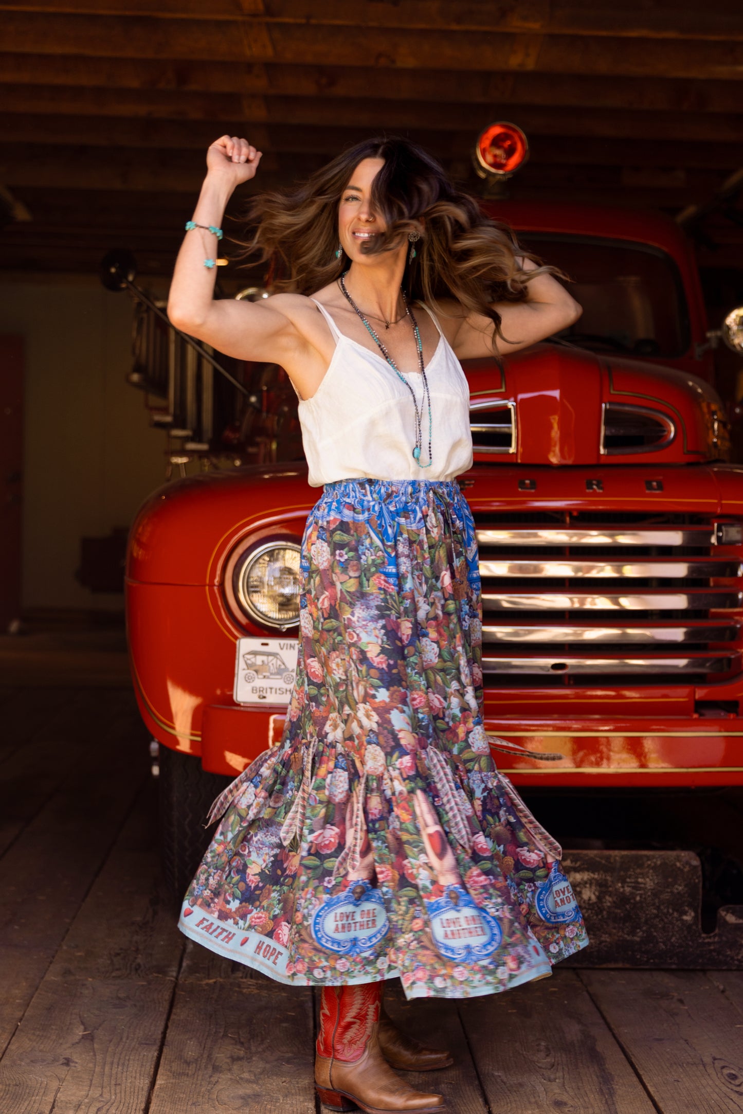 Model wearing a maxi-length skirt woven with 1854 artwork, heartfelt messages, and joyful blooms. Made from bamboo & wood blend viscose - Market of Stars