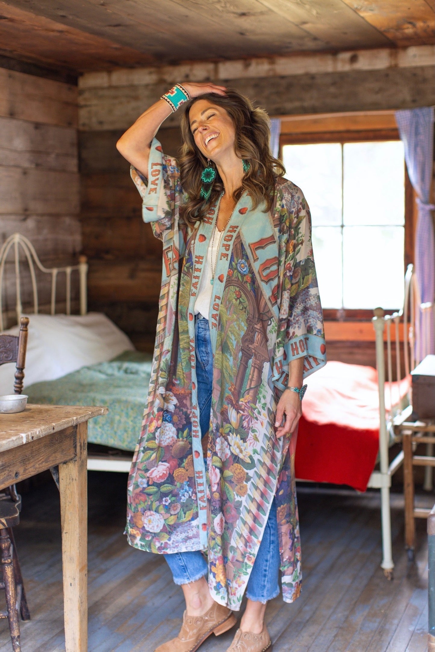Model wearing romantic full-length kimono featuring joyful 1854 floral art, heart-in-hand symbol, and handwritten messages of love – Market of Stars