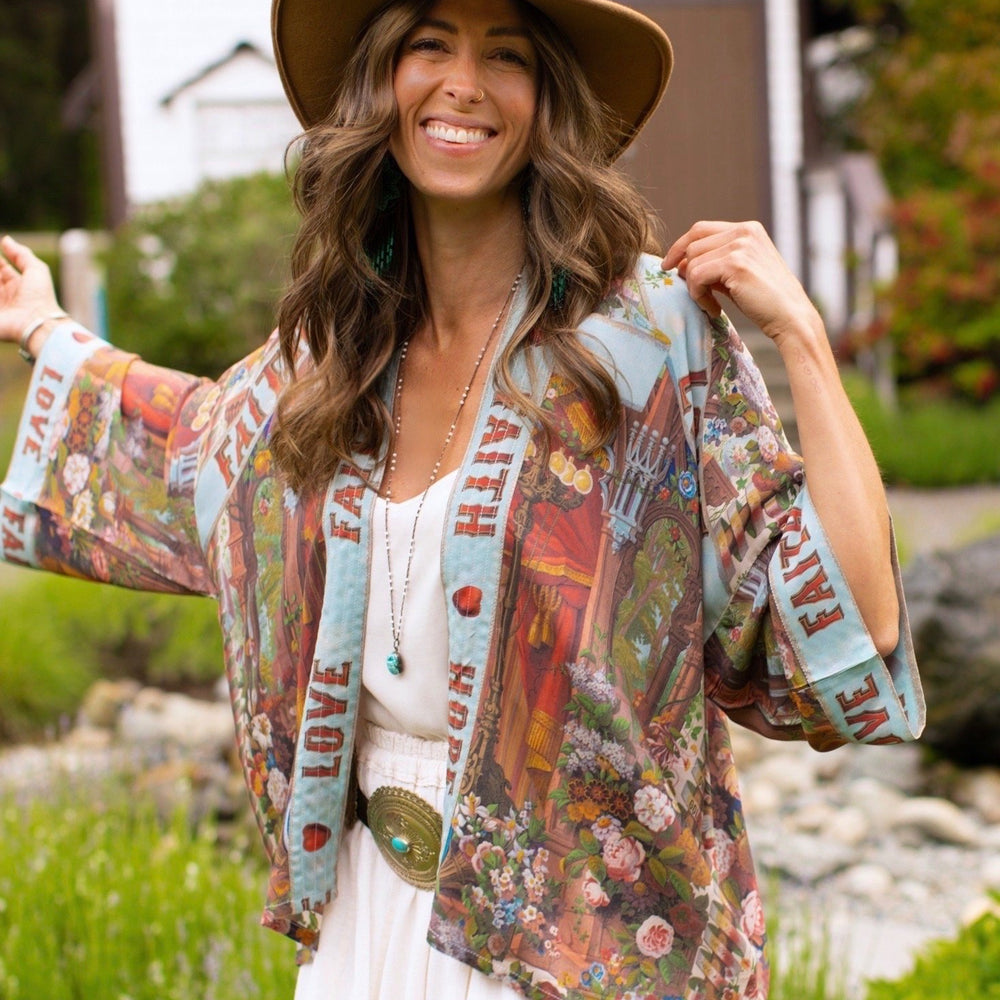 Model in cropped kimono featuring joyful 1854 floral art, heart-in-hand symbol, and handwritten love notes – Market of Stars.