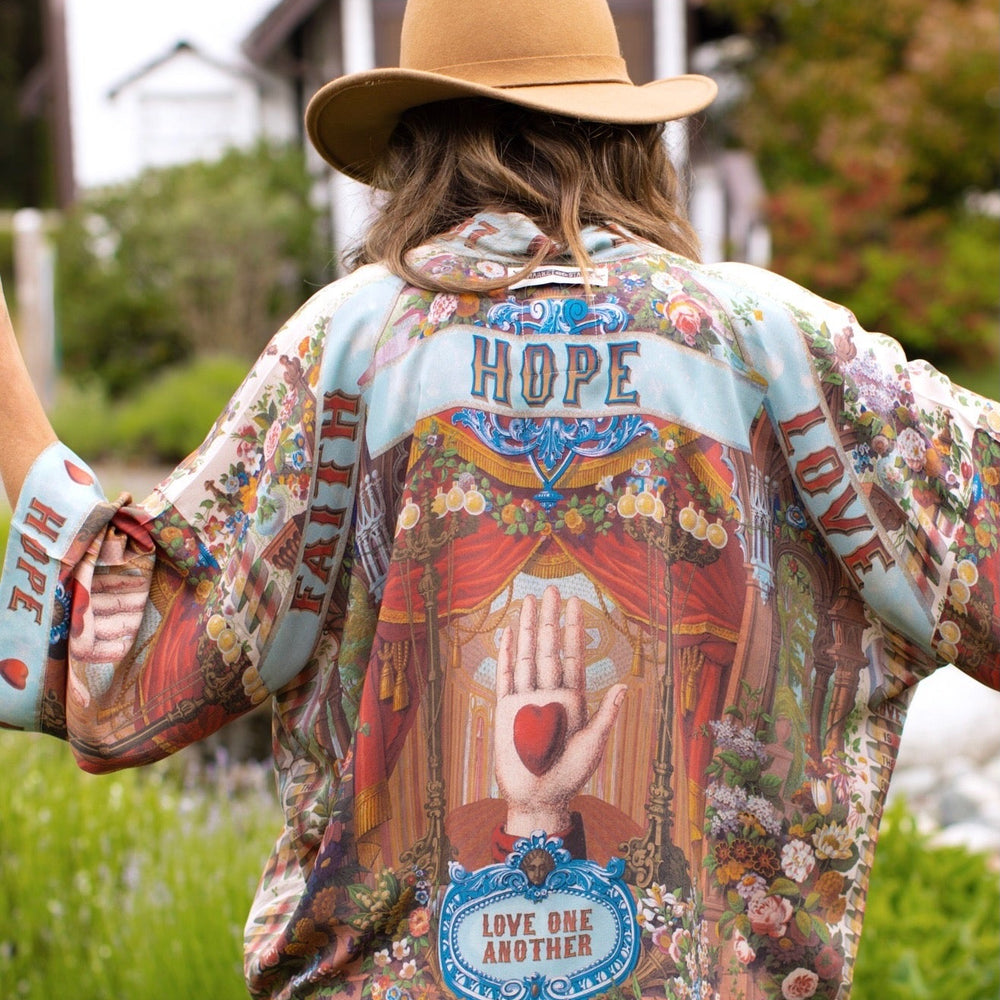 Model in cropped kimono featuring joyful 1854 floral art, heart-in-hand symbol, and handwritten love notes – Market of Stars.