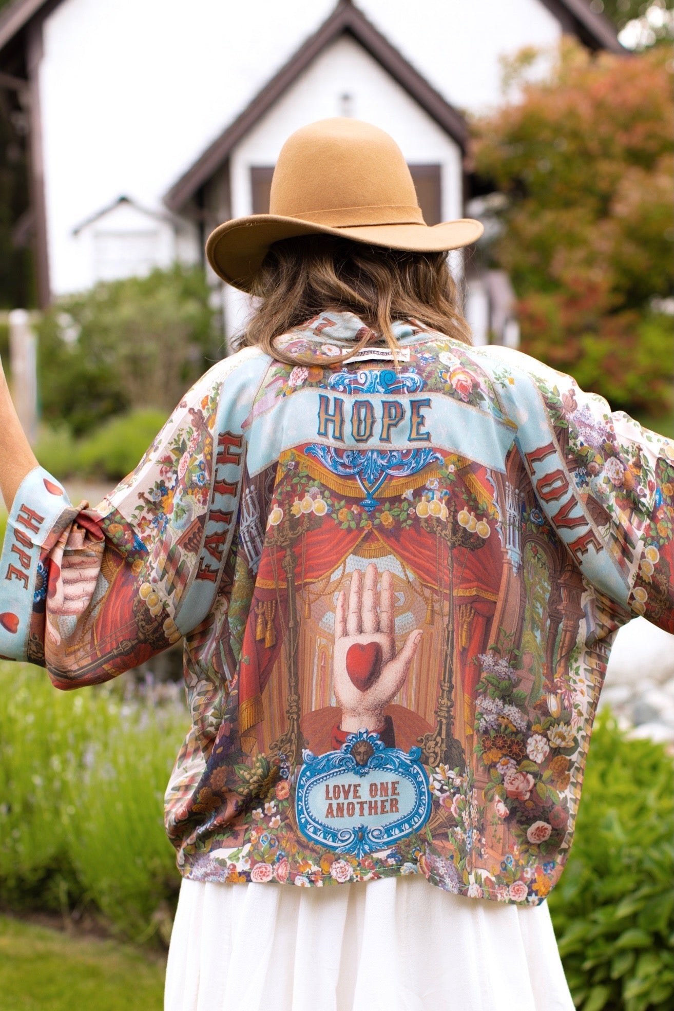 Model in cropped kimono featuring joyful 1854 floral art, heart-in-hand symbol, and handwritten love notes – Market of Stars.