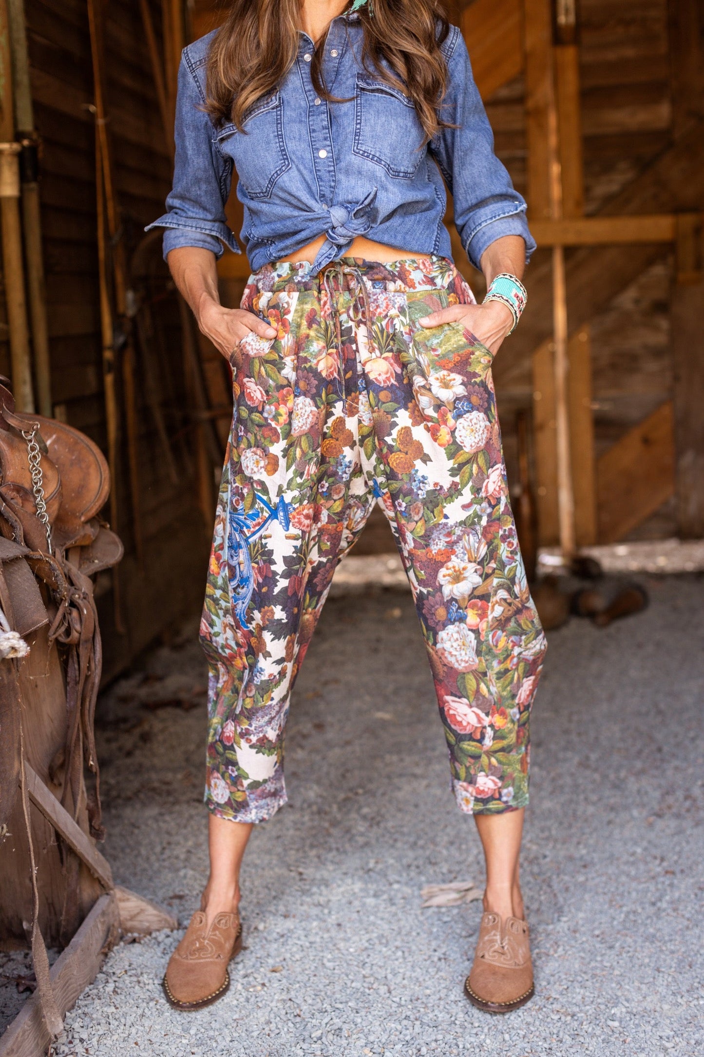Model wearing linen blend artist pants with 1854 floral art, heart-in-hand symbol, and “Love one another” handwritten script – Market of Stars.