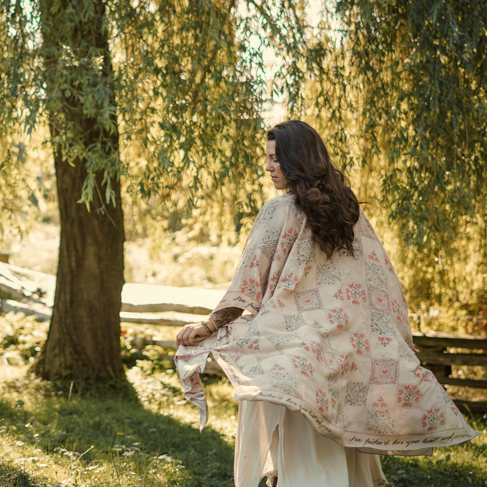 Model wearing romantic kimono with patchwork pattern made from a 200-year-old puzzle purse love letter featuring handwritten poetry and vintage florals – Market of Stars