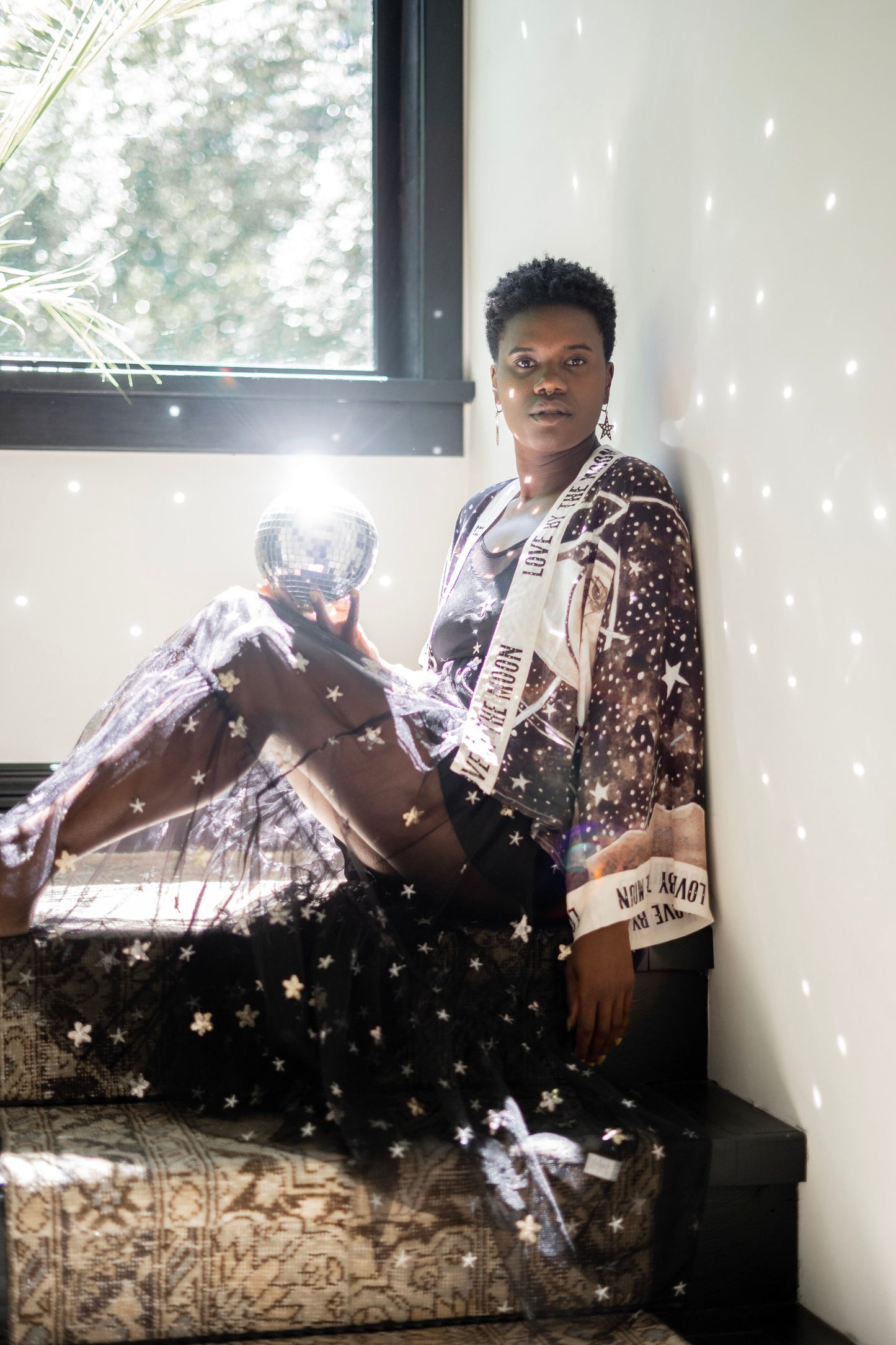 Model wearing Love By The Moon Kimono featuring sepia tones, vintage moon illustration, and retro typography inspired by early 1900s photo props – Market of Stars