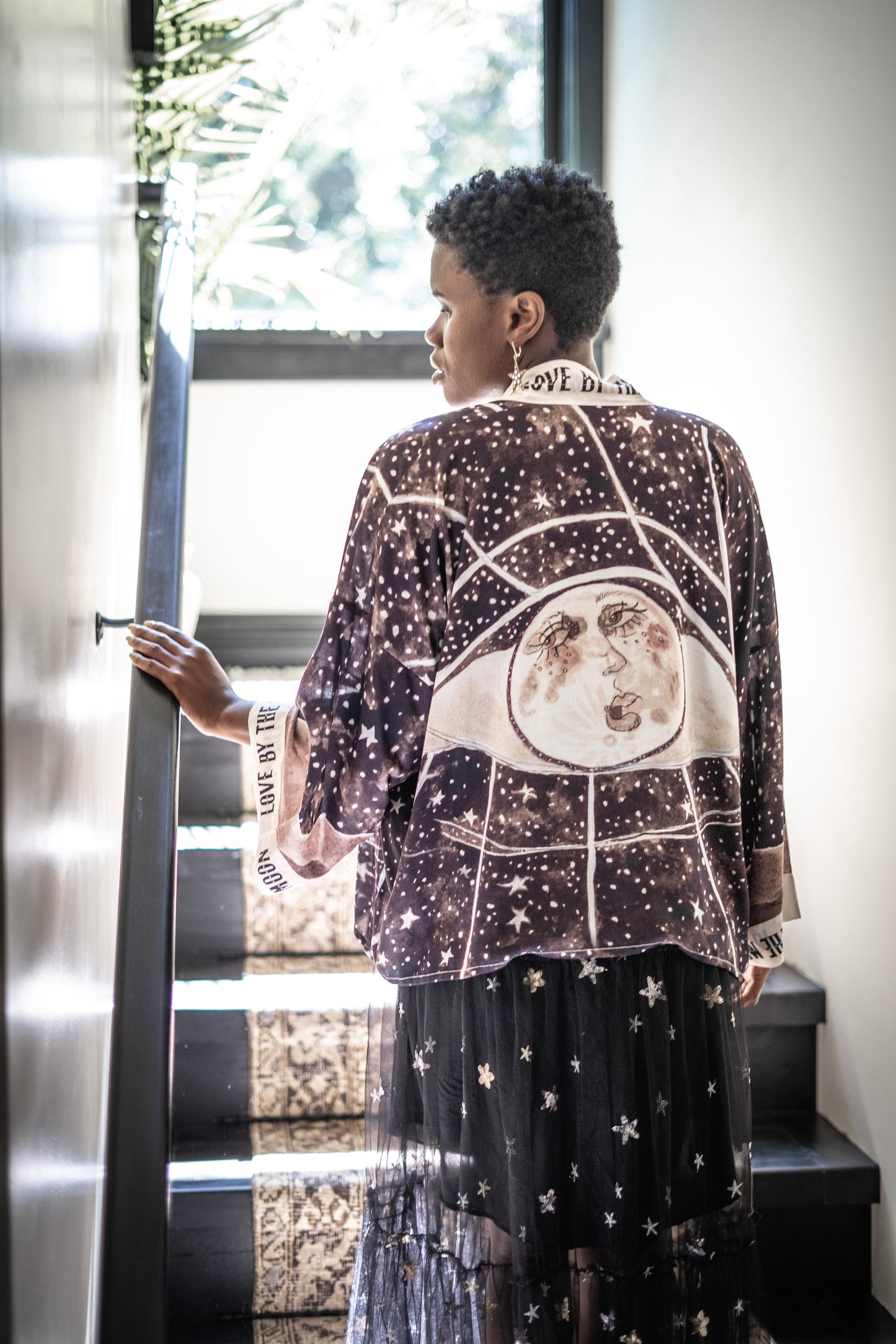 Model wearing Love By The Moon Kimono featuring sepia tones, vintage moon illustration, and retro typography inspired by early 1900s photo props – Market of Stars