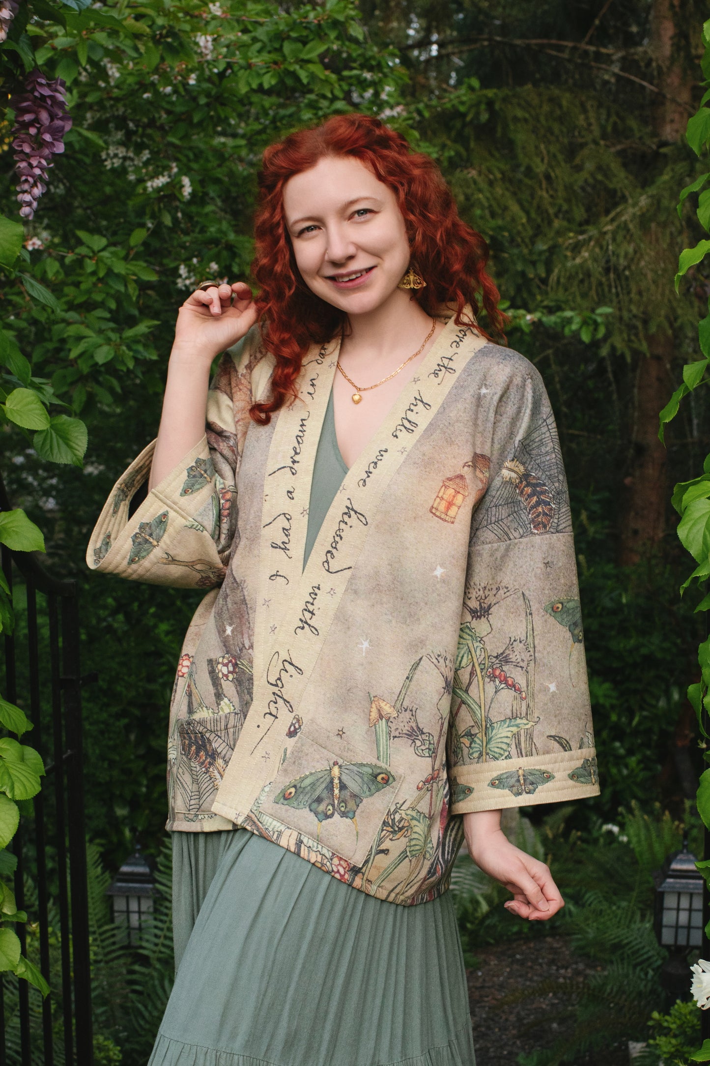 Model wearing the Lovelight Cottage Cardigan ft artwork by world-renowned illustrator Charles van Sandwyk - Market of Stars
