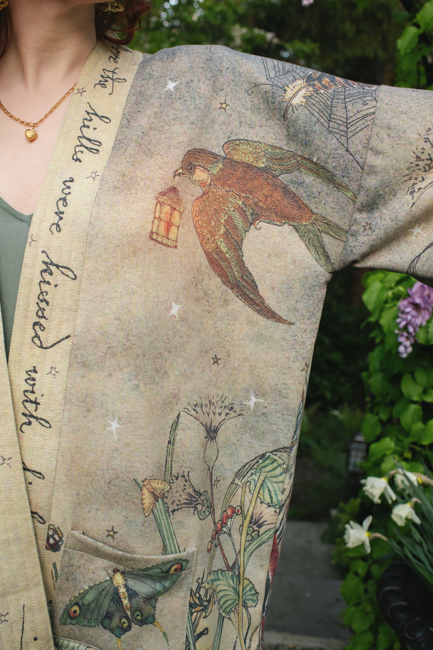 Model wearing the Lovelight Cottage Cardigan ft artwork by world-renowned illustrator Charles van Sandwyk - Market of Stars