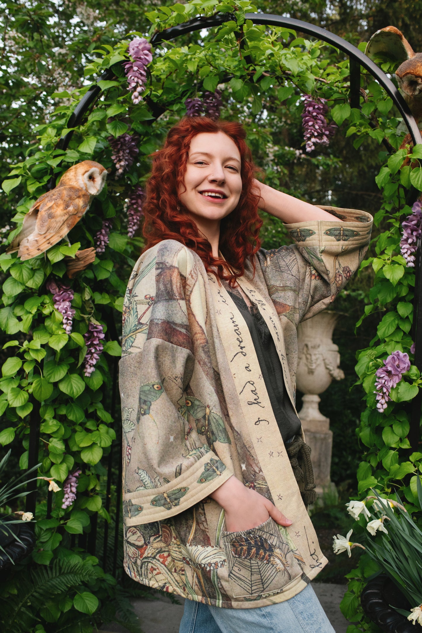 Model wearing the Lovelight Cottage Cardigan ft artwork by world-renowned illustrator Charles van Sandwyk - Market of Stars