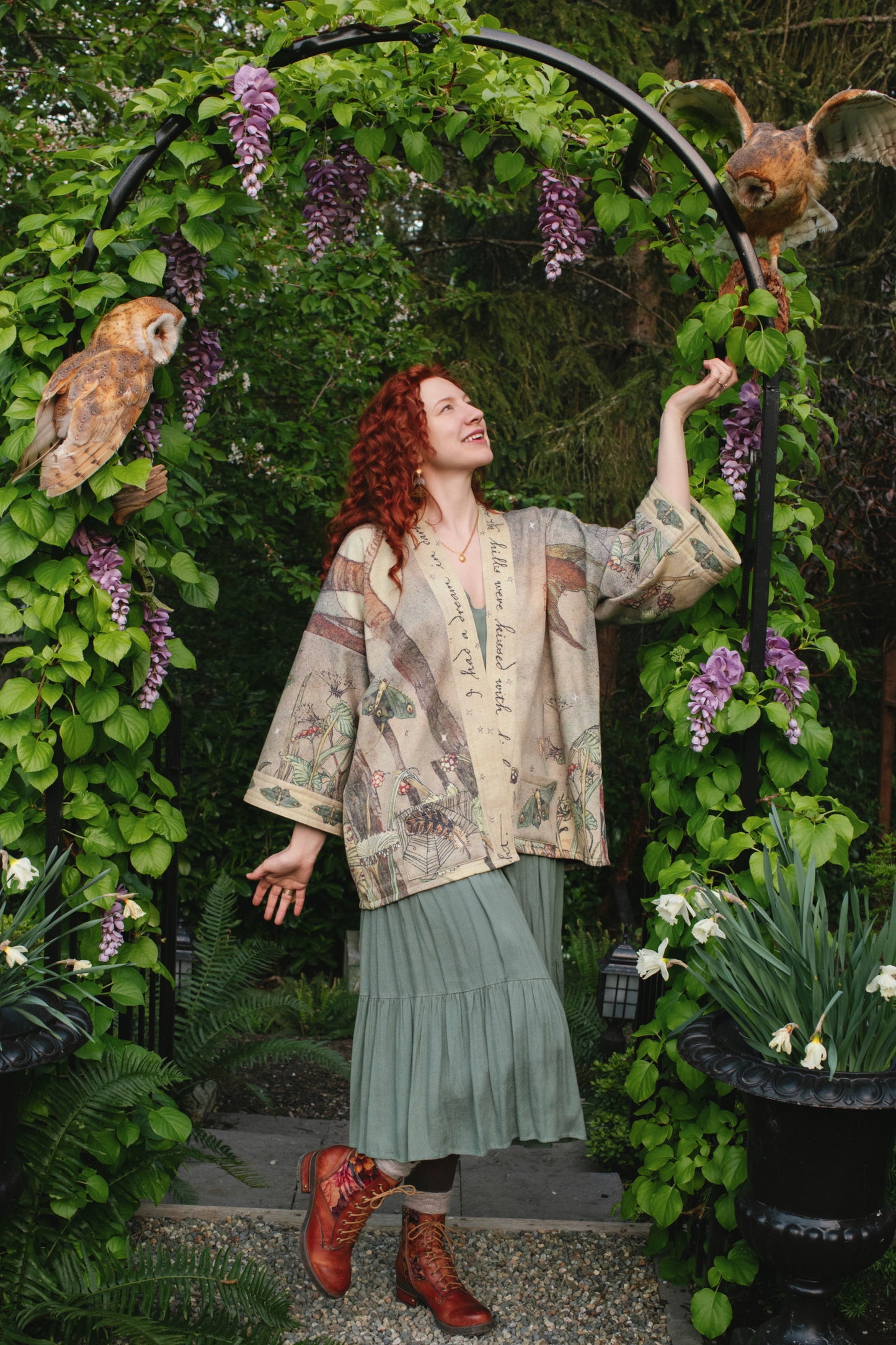 Model wearing the Lovelight Cottage Cardigan ft artwork by world-renowned illustrator Charles van Sandwyk - Market of Stars